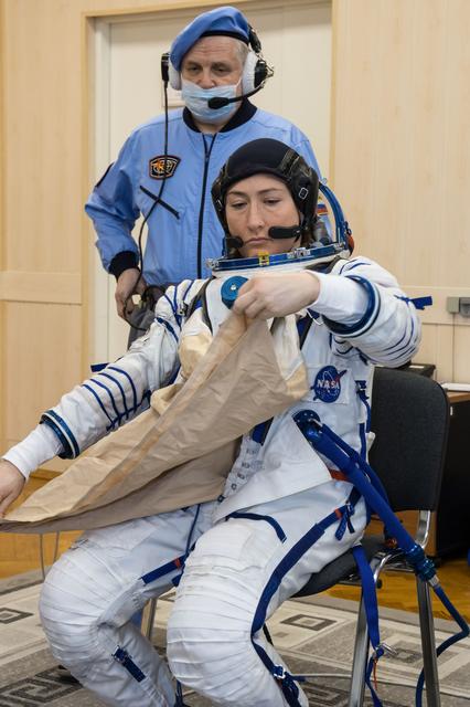 NASA image: jsc2019e009947 - At the Baikonur Cosmodrome in Kazakhstan, Expedition 59 crewmember Christina Koch of NASA suits up for a Soyuz fit check dress rehearsal Feb. 27 during pre-launch training. Koch, Nick Hague of NASA and Alexey Ovchinin of Roscosmos will la