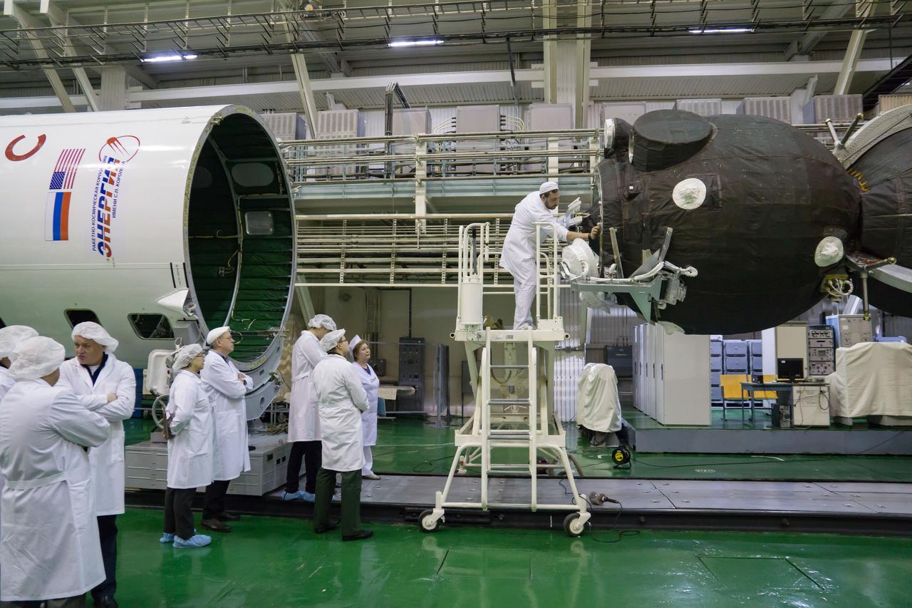 In the Integration Building at the Baikonur Cosmodrome in Kazakhstan, technicians check of the alignment of the Soyuz MS-12 spacecraft (right) with its Soyuz booster’s nose fairing (left) March 6 prior to its encapsulation into the Soyuz booster rocket. Expedition 59 crewmembers Nick Hague and Christina Koch of NASA and Alexey Ovchinin of Roscosmos will launch on March 14, U.S. time, on the Soyuz MS-12 spacecraft from the Baikonur Cosmodrome for a six-and-a-half month mission on the International Space Station...NASA/Victor Zelentsov.