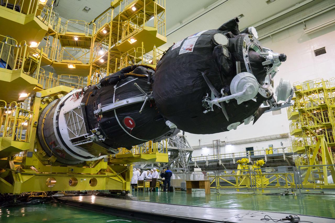 In the Integration Building at the Baikonur Cosmodrome in Kazakhstan, the Soyuz MS-12 spacecraft is lowered into position March 6 prior to its encapsulation into the nose fairing of the Soyuz booster rocket. Expedition 59 crewmembers Nick Hague and Christina Koch of NASA and Alexey Ovchinin of Roscosmos will launch on March 14, U.S. time, on the Soyuz MS-12 spacecraft from the Baikonur Cosmodrome for a six-and-a-half month mission on the International Space Station...NASA/Victor Zelentsov.