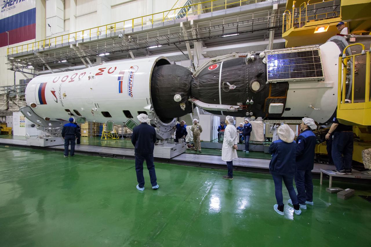 In the Integration Building at the Baikonur Cosmodrome in Kazakhstan, the Soyuz MS-12 spacecraft is encapsulated into the nose fairing of the Soyuz booster rocket March 6. Expedition 59 crewmembers Nick Hague and Christina Koch of NASA and Alexey Ovchinin of Roscosmos will launch on March 14, U.S. time, on the Soyuz MS-12 spacecraft from the Baikonur Cosmodrome for a six-and-a-half month mission on the International Space Station...NASA/Victor Zelentsov.