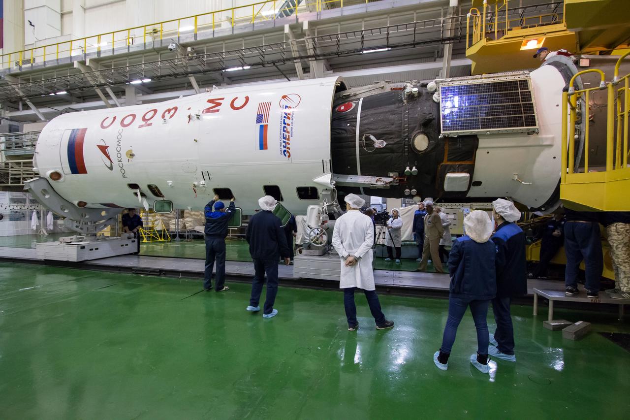 In the Integration Building at the Baikonur Cosmodrome in Kazakhstan, the Soyuz MS-12 spacecraft is encapsulated into the nose fairing of the Soyuz booster rocket March 6. Expedition 59 crewmembers Nick Hague and Christina Koch of NASA and Alexey Ovchinin of Roscosmos will launch on March 14, U.S. time, on the Soyuz MS-12 spacecraft from the Baikonur Cosmodrome for a six-and-a-half month mission on the International Space Station...NASA/Victor Zelentsov.