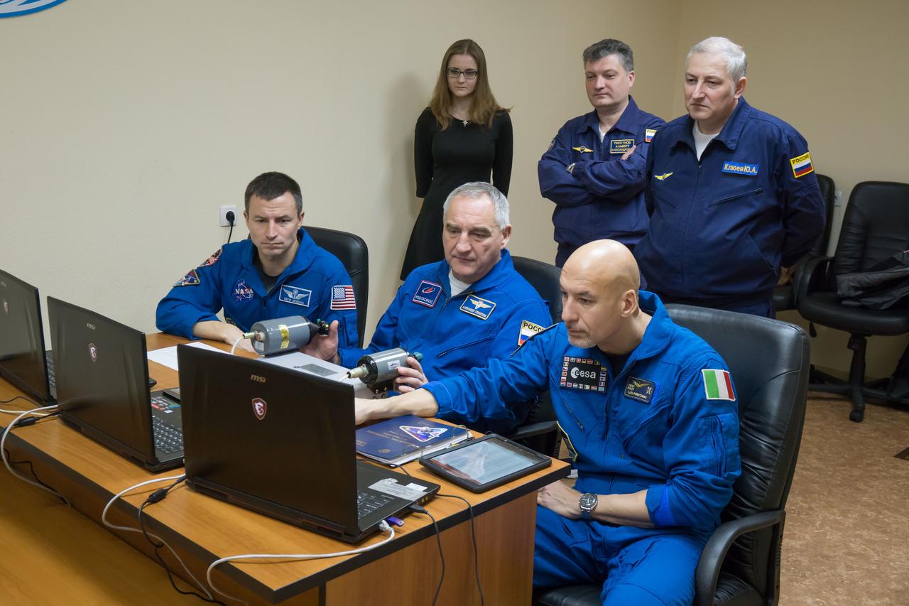 At their Cosmonaut Hotel crew quarters in Baikonur, Kazakhstan, Expedition 59 backup crewmembers Drew Morgan of NASA (left), Alexander Skvortsov of Roscosmos (center) and Luca Parmitano of the European Space Agency (right) rehearse rendezvous and docking techniques on a laptop computer simulator March 7 as they conduct pre-launch preparations. They are the backups to the prime crewmembers, Christina Koch of NASA, Alexey Ovchinin of Roscosmos and Nick Hague of NASA, who will launch March 14, U.S. time, on the Soyuz MS-12 spacecraft from the Baikonur Cosmodrome for a six-and-a-half month mission on the International Space Station...NASA/Victor Zelentsov.