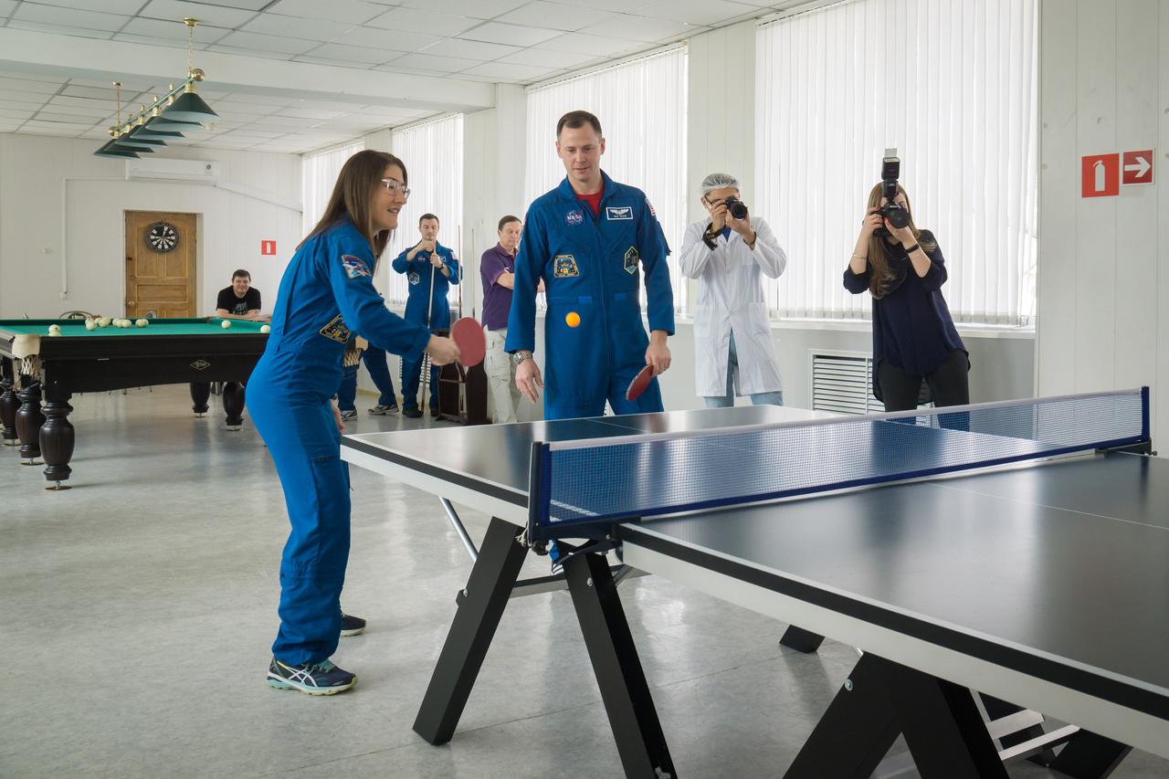 At their Cosmonaut Hotel crew quarters in Baikonur, Kazakhstan, Expedition 59 crewmembers Christina Koch of NASA (left) and Nick Hague of NASA (right) play a game of ping-pong March 7 as they take a break from pre-launch training. Along with Alexey Ovchinin of Roscosmos, they will launch March 14, U.S. time, on the Soyuz MS-12 spacecraft from the Baikonur Cosmodrome for a six-and-a-half month mission on the International Space Station...NASA/Victor Zelentsov.