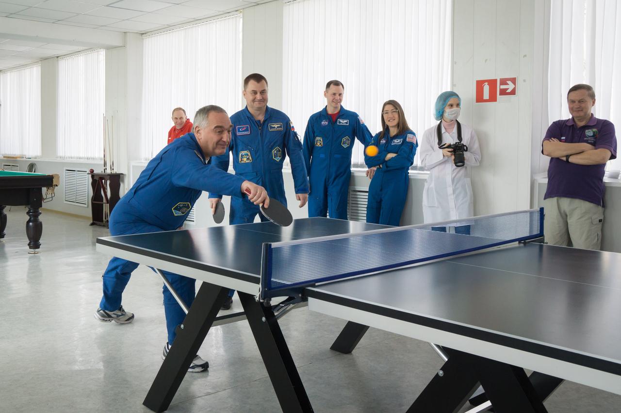 At their Cosmonaut Hotel crew quarters in Baikonur, Kazakhstan, Expedition 59 backup crewmember Alexander Skvortsov of Roscosmos (left) and prime crewmember Alexey Ovchinin of Roscosmos (right) take a break from pre-launch training March 7 for a game of ping-pong. Looking on against the wall are prime crewmembers Nick Hague and Christina Koch of NASA. Ovchinin, Hague and Koch will launch March 14, U.S. time, on the Soyuz MS-12 spacecraft from the Baikonur Cosmodrome for a six-and-a-half month mission on the International Space Station...NASA/Victor Zelentsov.
