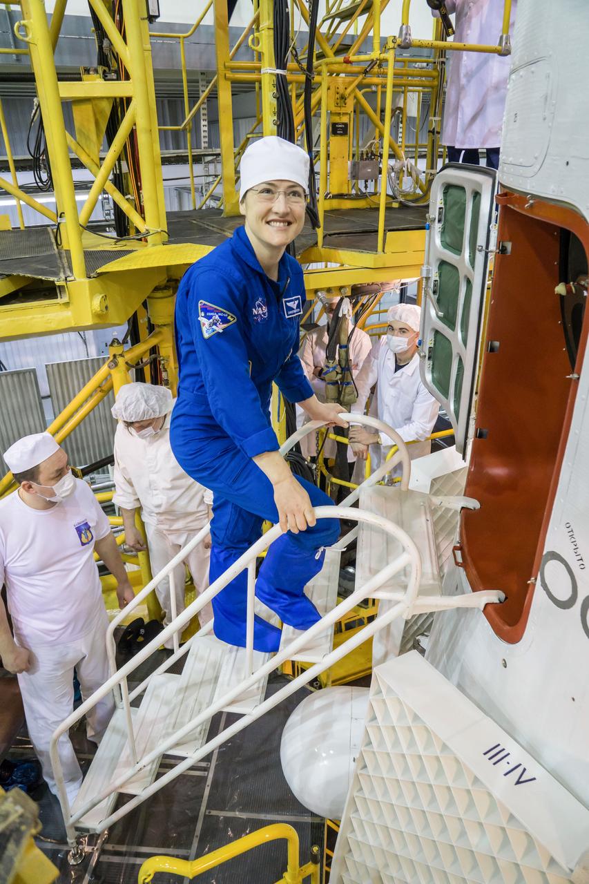 jsc2019e013414 - In the Integration Building at the Baikonur Cosmodrome in Kazakhstan, Expedition 59 crewmember Christina Koch of NASA poses for pictures March 10 as she climbs aboard the Soyuz MS-12 spacecraft for final pre-launch preparations. Koch, Nick Hague of NASA and Alexey Ovchinin of Roscosmos will launch March 14, U.S. time, in the Soyuz MS-12 spacecraft from the Baikonur Cosmodrome for a six-and-a-half month mission on the International Space Station...NASA/Victor Zelentsov..
