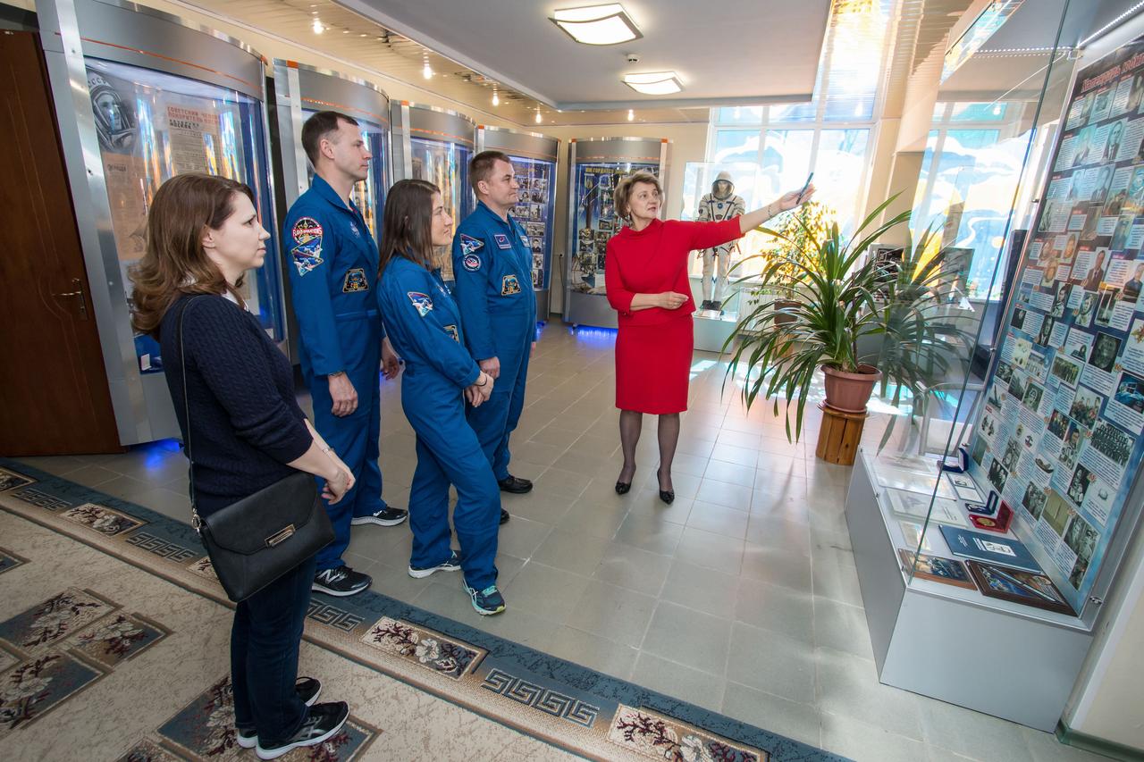 jsc2019e013417 - At the Baikonur Cosmodrome Museum in Kazakhstan, Expedition 59 crewmembers Nick Hague of NASA (second from left), Christina Koch of NASA (third from left) and Alexey Ovchinin of Roscosmos (second from right) receive a tutorial from a curator on famous artifacts housed in the museum March 10 as part of traditional pre-launch activities. Koch, Hague and Ovchinin will launch March 14, U.S. time, in the Soyuz MS-12 spacecraft from the Baikonur Cosmodrome for a six-and-a-half month mission on the International Space Station...NASA/Victor Zelentsov.
