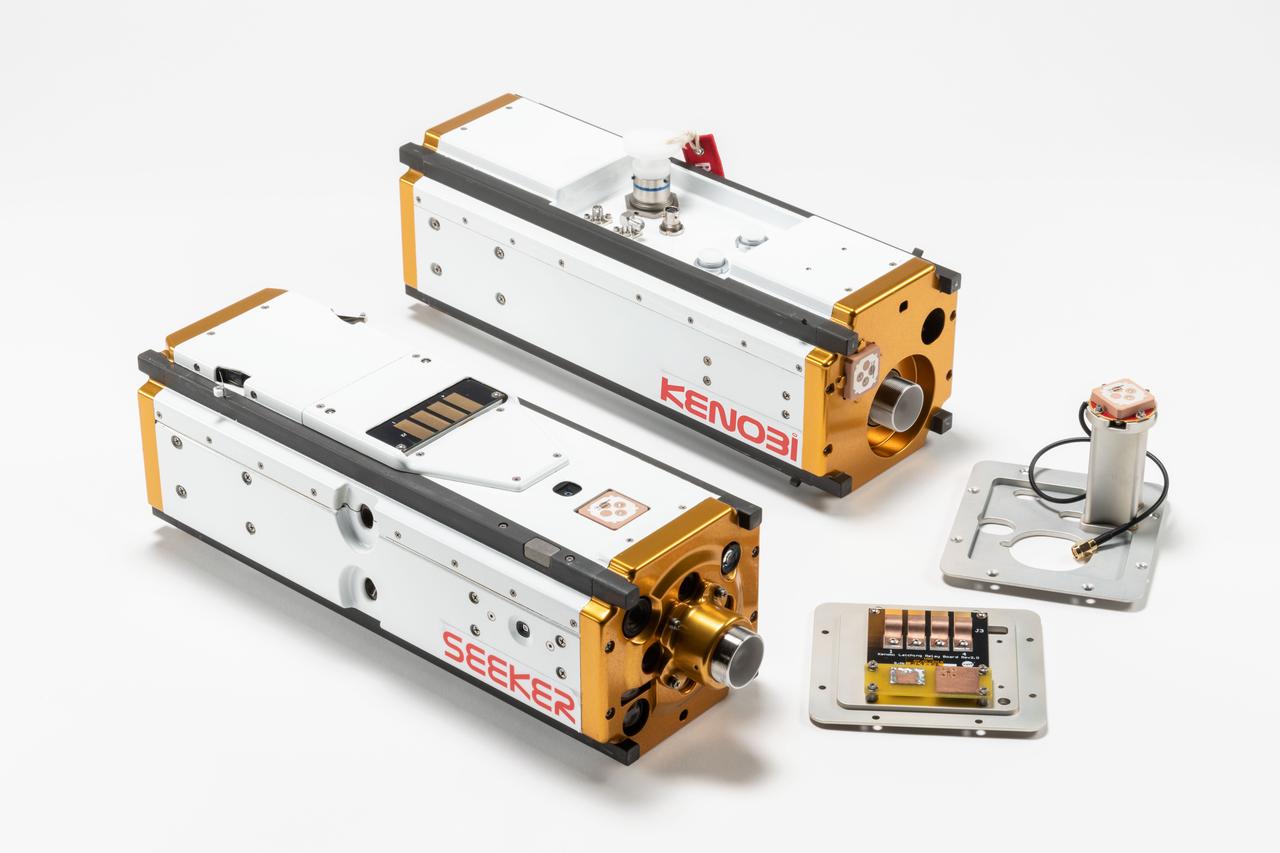 jsc2019e025857_alt (3/8/2019) --- Seeker and its communication link, called Kenobi CubeSat Vehicles. Seeker is an automated extravehicular free-flying inspector CubeSat. The primary objective of the Seeker mission is to demonstrate a path toward an inspection capability for future crewed space missions. The Seeker investigation flies the robot on basic maneuvers to take high-resolution images of the Cygnus resupply vehicle after it leaves the International Space Station (ISS).