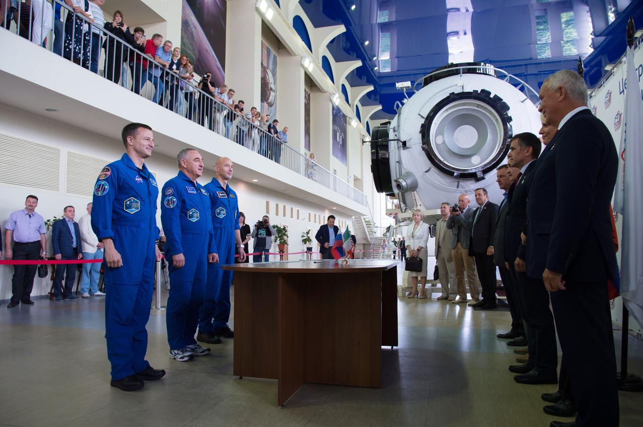 jsc2019e035254 - At the Gagarin Cosmonaut Training Center in Star City, Russia, Expedition 60 crewmembers Drew Morgan of NASA (left), Alexander Skvortsov of Roscosmos (center) and Luca Parmitano of the European Space Agency (right) report for their final qualification exams June 26. They will launch July 20 on the Soyuz MS-13 spacecraft from the Baikonur Cosmodrome in Kazakhstan for a mission on the International Space Station...NASA/Beth Weissinger.
