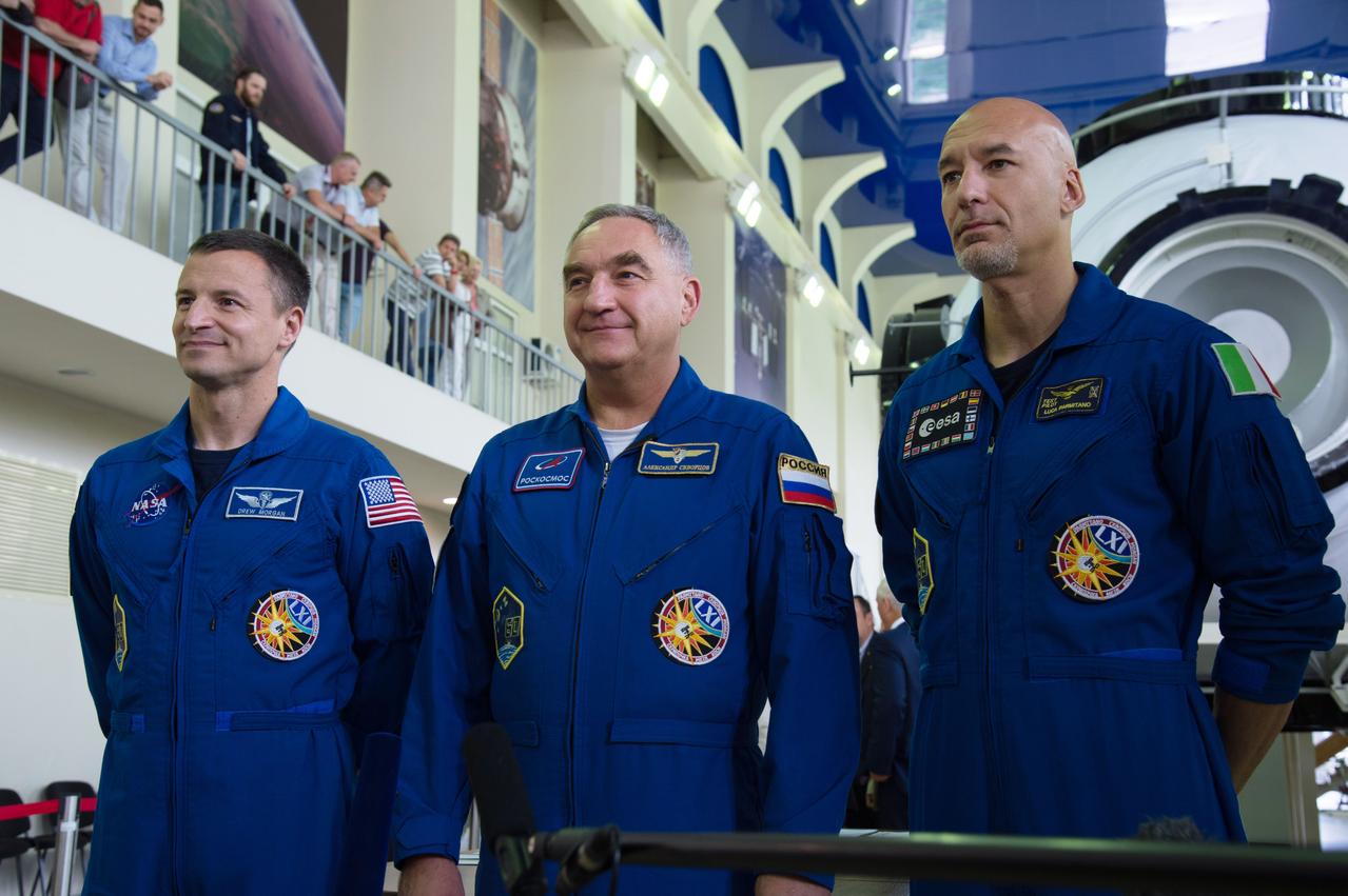 jsc2019e035258 - At the Gagarin Cosmonaut Training Center in Star City, Russia, Expedition 60 crewmembers Drew Morgan of NASA (left), Alexander Skvortsov of Roscosmos (center) and Luca Parmitano of the European Space Agency (right) pose for pictures June 26 during final qualification exams. They will launch July 20 on the Soyuz MS-13 spacecraft from the Baikonur Cosmodrome in Kazakhstan for a mission on the International Space Station...NASA/Beth Weissinger.