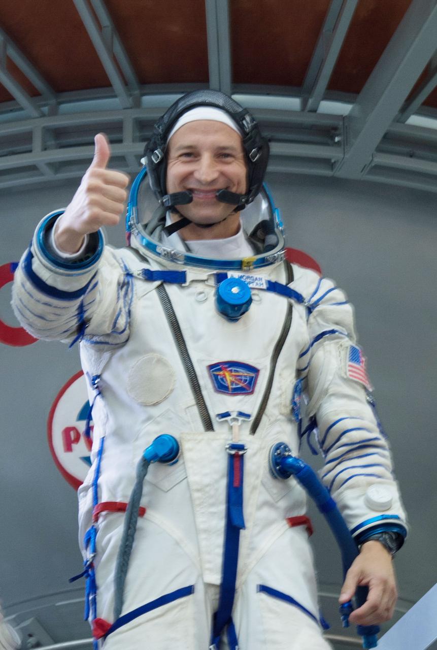 jsc2019e035390 - At the Gagarin Cosmonaut Training Center in Star City, Russia, Expedition 60 crewmember Drew Morgan of NASA flashes a thumbs up signal during the final day of qualification exams June 27. Morgan, Alexander Skvortsov of Roscosmos and Luca Parmitano of the European Space Agency will launch on July 20 from the Baikonur Cosmodrome in Kazakhstan on the Soyuz MS-13 spacecraft for a mission to the International Space Station...NASA/Beth Weissinger.