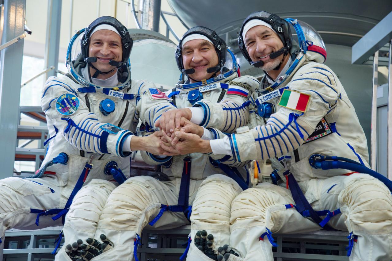 jsc2019e035391 - At the Gagarin Cosmonaut Training Center in Star City, Russia, Expedition 60 crewmembers Drew Morgan of NASA (left), Alexander Skvortsov of Roscosmos (center) and Luca Parmitano of the European Space Agency (right) pose for pictures June 27 during the final day of their qualification exams. They will launch on July 20 from the Baikonur Cosmodrome in Kazakhstan on the Soyuz MS-13 spacecraft for a mission to the International Space Station...NASA/Beth Weissinger.