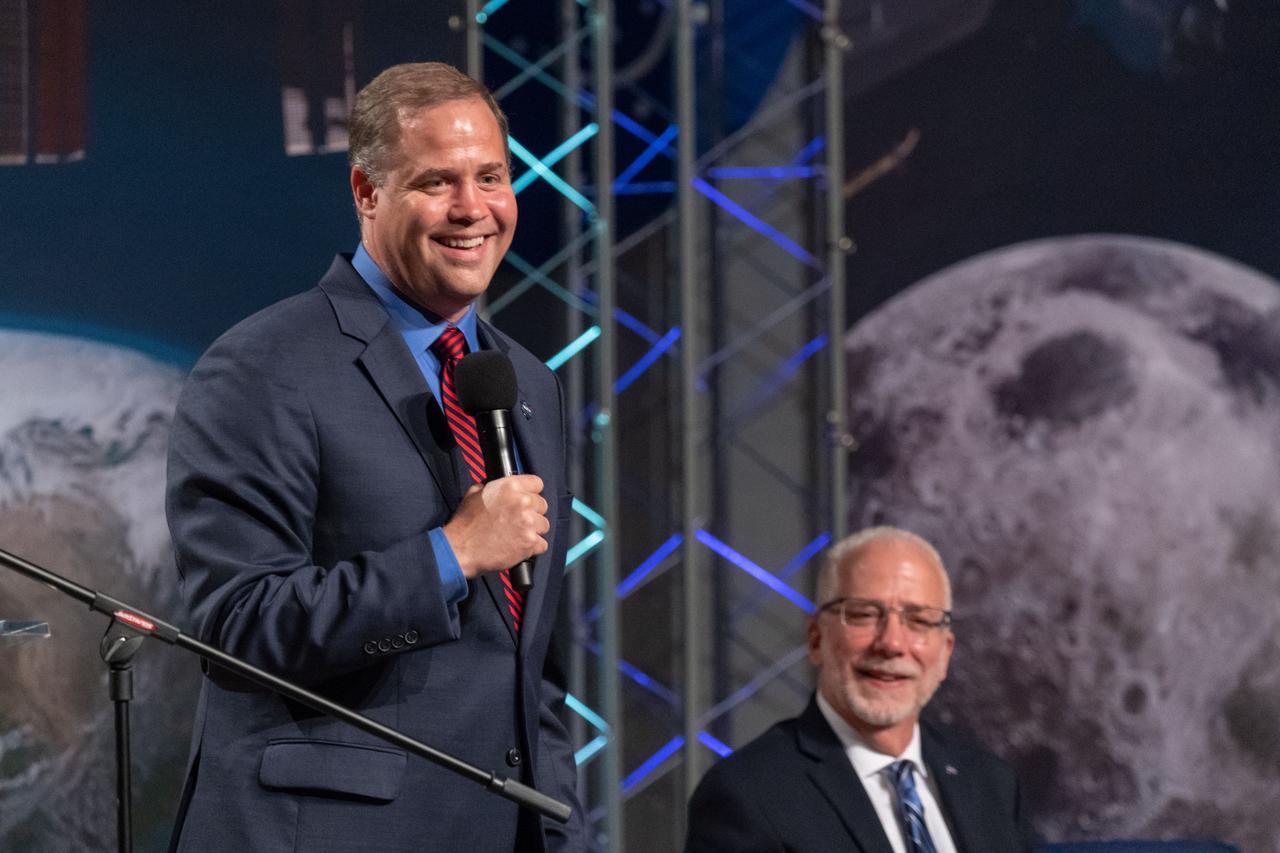 jsc2019e036680 (June 28, 2019) – NASA Administrator Jim Bridenstine talks to grand opening visitors in NASA Johnson Space Center’s Teague Auditorium as Johnson Space Center Director Mark Geyer looks on. NASA’s Johnson Space Center reopened the fully restored Apollo Mission Control Center with a grand opening and ribbon cutting event with Bridenstine on June 28. The room now is reconfigured to its Apollo-era condition. Many of the items in the restored room are original pieces from 1969 that were found or donated, and the missing items were replicated to ensure walking into the viewing room would feel like taking a step back in time. The restoration team used old photographs, footage, documents and interviews and discussions with Apollo veterans to set everything in its proper place, including coffee mugs, clothing articles and ashtrays. Beginning July 1, the Apollo Mission Control Center will become part of daily tours at Johnson hosted by Space Center Houston.