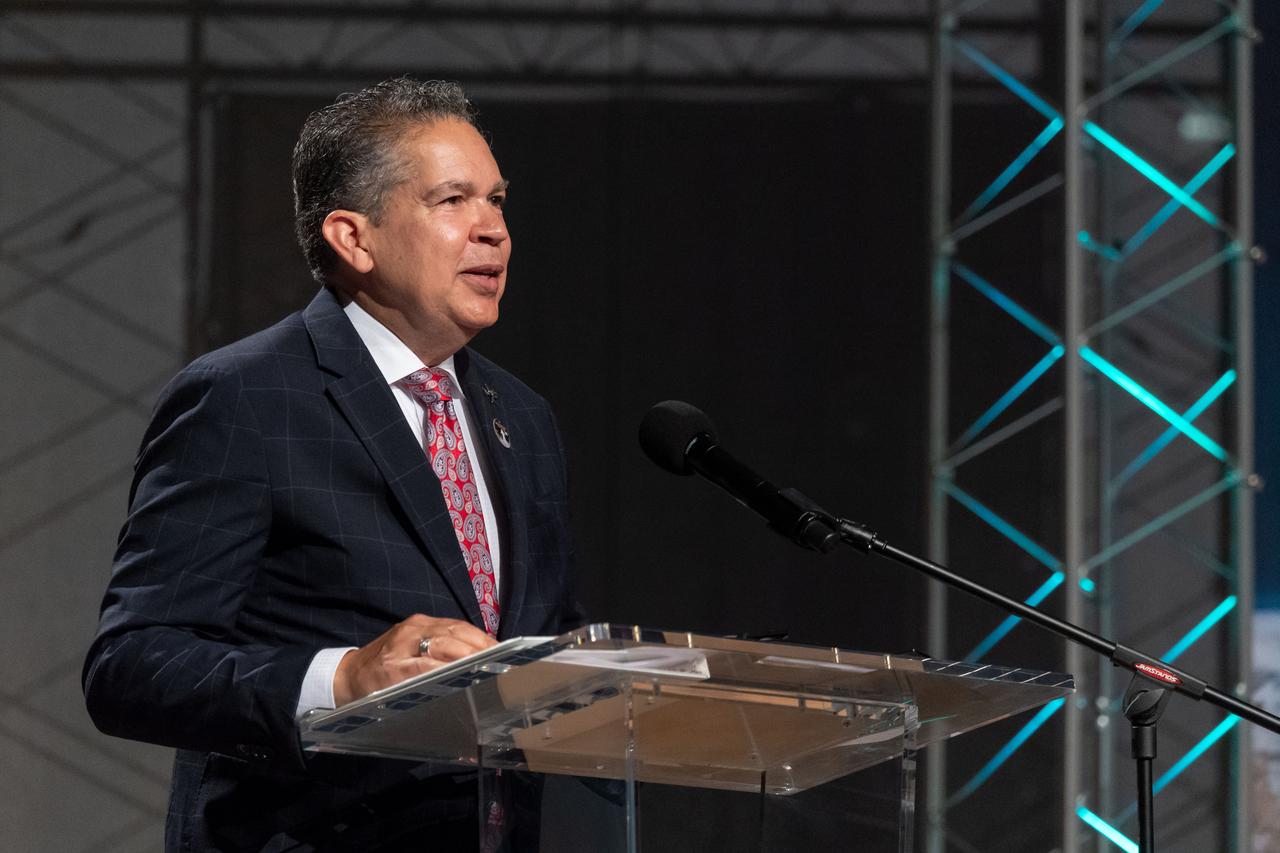 jsc2019e036685 (June 28, 2019) – Space Center Houston CEO William Harris talks to the audience for the grand opening of the fully restored Apollo Mission Control Center. NASA’s Johnson Space Center reopened the facility with a grand opening and ribbon cutting event on June 28. The room now is reconfigured to its Apollo-era condition. Many of the items in the restored room are original pieces from 1969 that were found or donated, and the missing items were replicated to ensure walking into the viewing room would feel like taking a step back in time. The restoration team used old photographs, footage, documents and interviews and discussions with Apollo veterans to set everything in its proper place, including coffee mugs, clothing articles and ashtrays. Beginning July 1, the Apollo Mission Control Center will become part of daily tours at Johnson hosted by Space Center Houston.