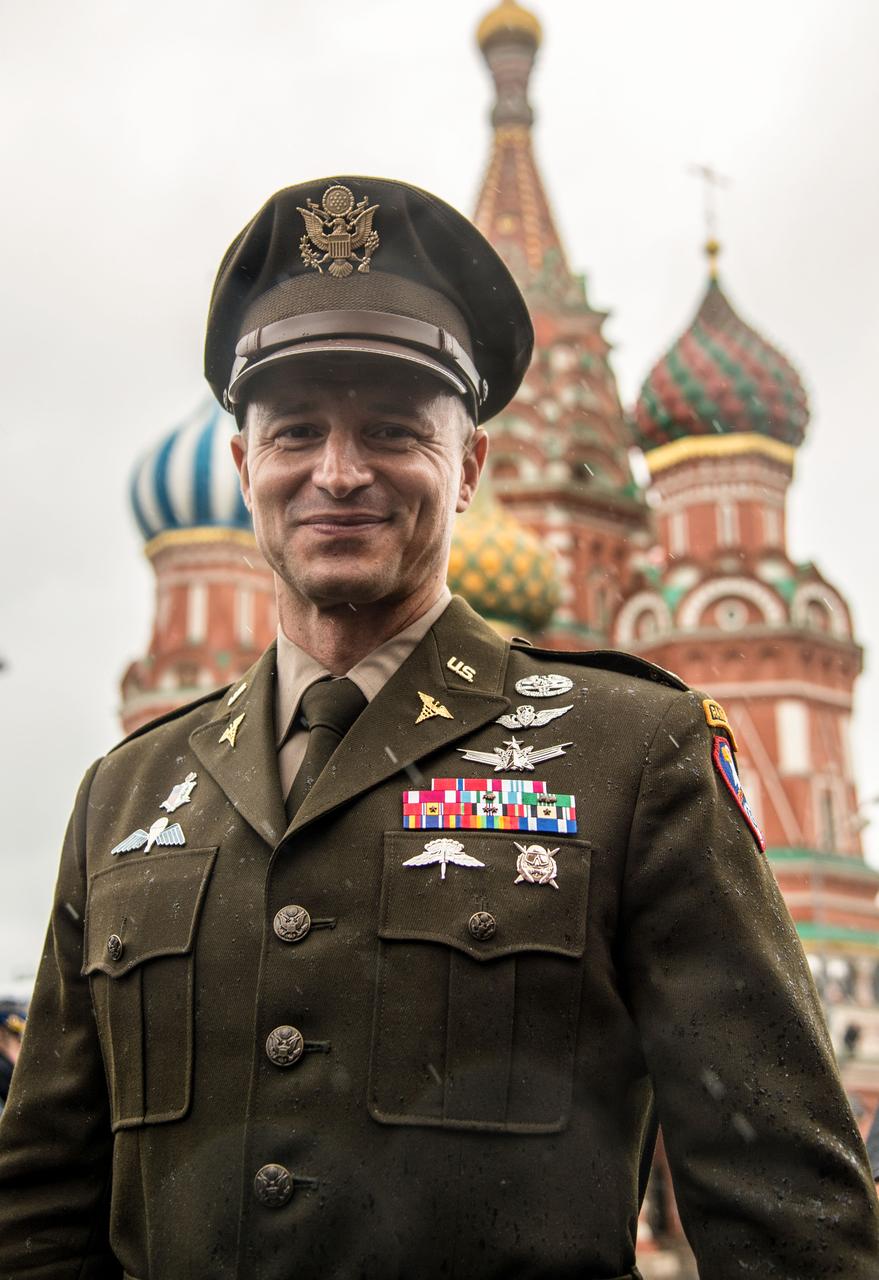jsc2019e036814 - With St. Basil’s Cathedral in Moscow’s Red Square providing the backdrop, Expedition 60 crewmember Drew Morgan of NASA poses for pictures June 28 as part of traditional pre-launch activities. Morgan, Luca Parmitano of the European Space Agency and Alexander Skvortsov of Roscosmos will launch July 20 on the Soyuz MS-13 spacecraft from the Baikonur Cosmodrome in Kazakhstan for a mission on the International Space Station...NASA/Beth Weissinger.