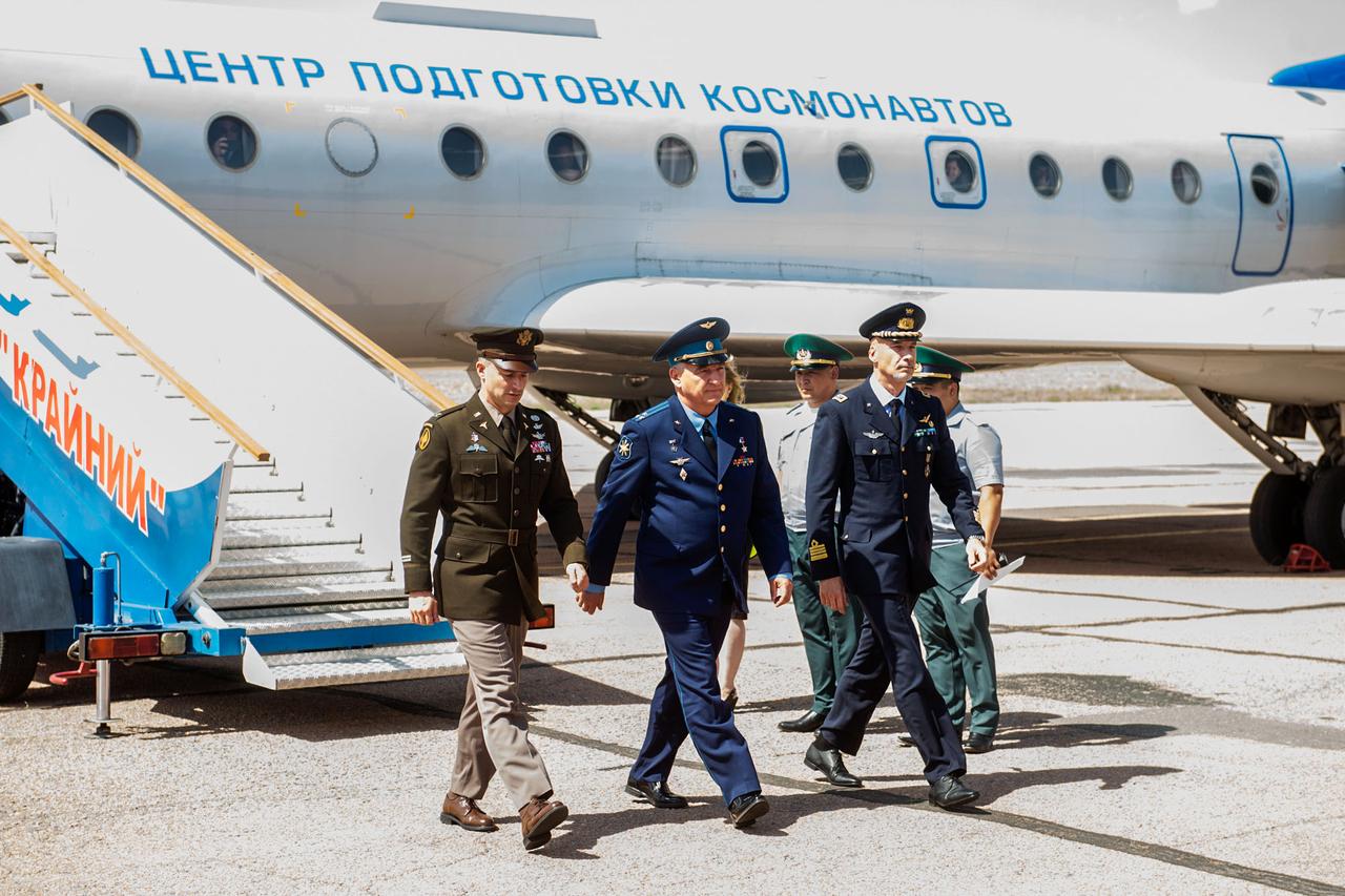jsc2019e038368 - At the Baikonur Cosmodrome in Kazakhstan, Expedition 60 crewmembers Drew Morgan of NASA (left), Alexander Skvortsov of Roscosmos (center) and Luca Parmitano of the European Space Agency (right) arrive July 4 for final pre-launch preparations after a flight from their training base outside Moscow. They will launch July 20 from the Baikonur Cosmodrome in Kazakhstan on the Soyuz MS-13 spacecraft for a mission on the International Space Station...Andrey Shelepin/GCTC.
