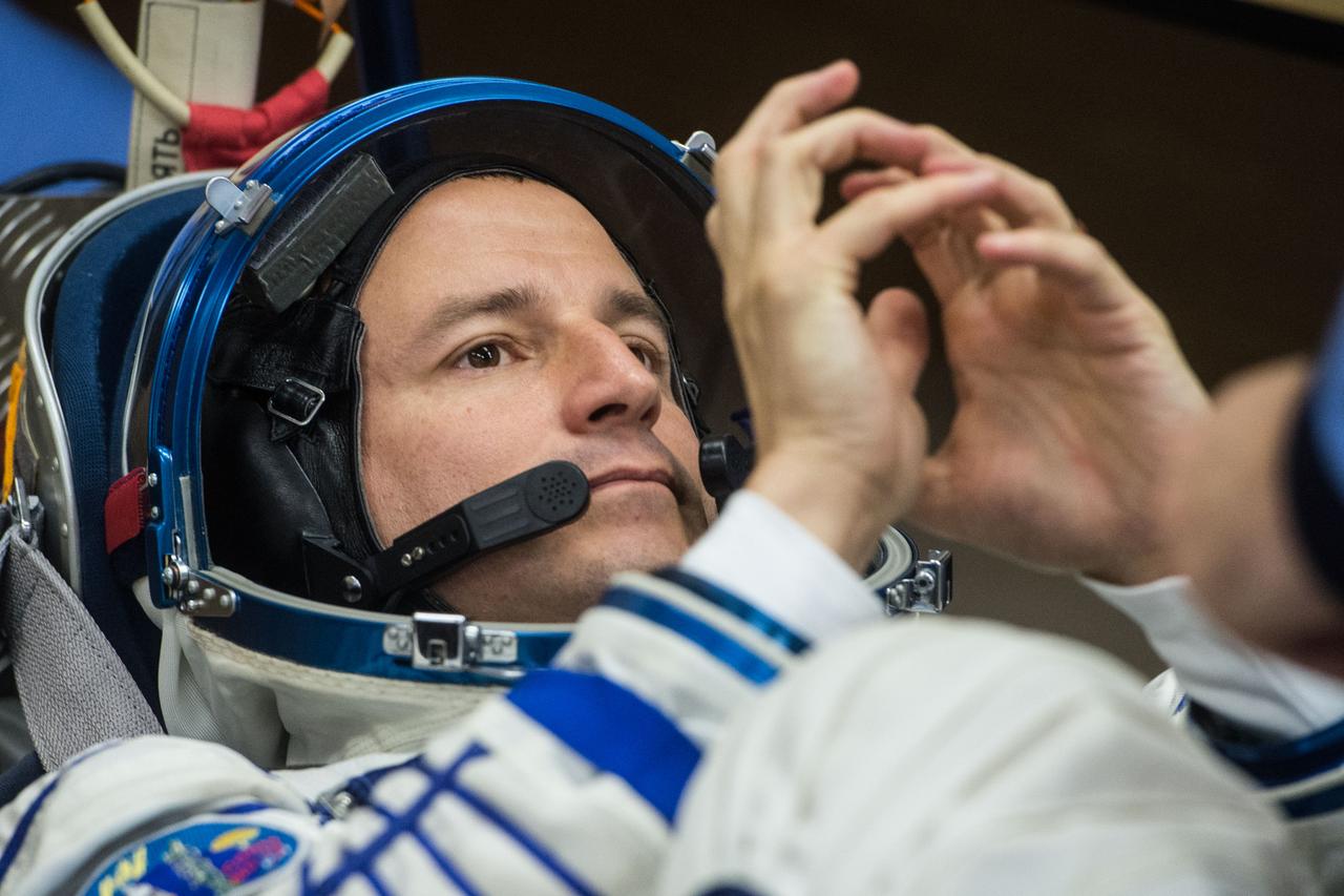jsc2019e038378 - At the Baikonur Cosmodrome in Kazakhstan, Expedition 60 crewmember Drew Morgan of NASA undergoes a Sokol launch and entry suit leak check July 5 as part of pre-launch preparations. Morgan, Luca Parmitano of the European Space Agency and Alexander Skvortsov of Roscosmos will launch July 20 on the Soyuz MS-13 spacecraft from the Baikonur Cosmodrome for a mission on the International Space Station...Andrey Shelepin/GCTC.
