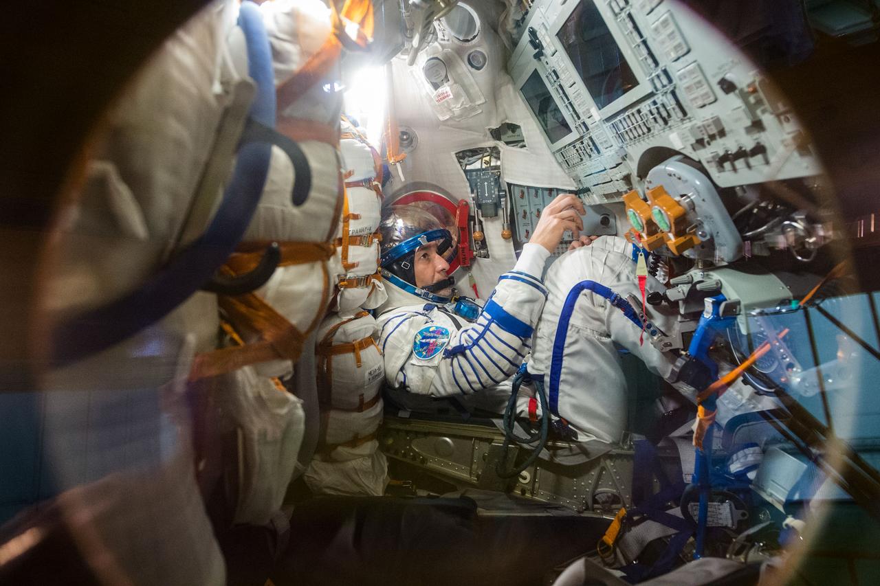 jsc2019e038384 - At the Baikonur Cosmodrome in Kazakhstan, Expedition 60 crewmember Luca Parmitano of the European Space Agency works procedures inside his Soyuz spacecraft July 5 as part of pre-launch activities.Parmitano, Drew Morgan of NASA and Alexander Skvortsov of Roscosmos will launch July 20 on the Soyuz MS-13 spacecraft from the Baikonur Cosmodrome for a mission on the International Space Station...Andrey Shelepin/GCTC.