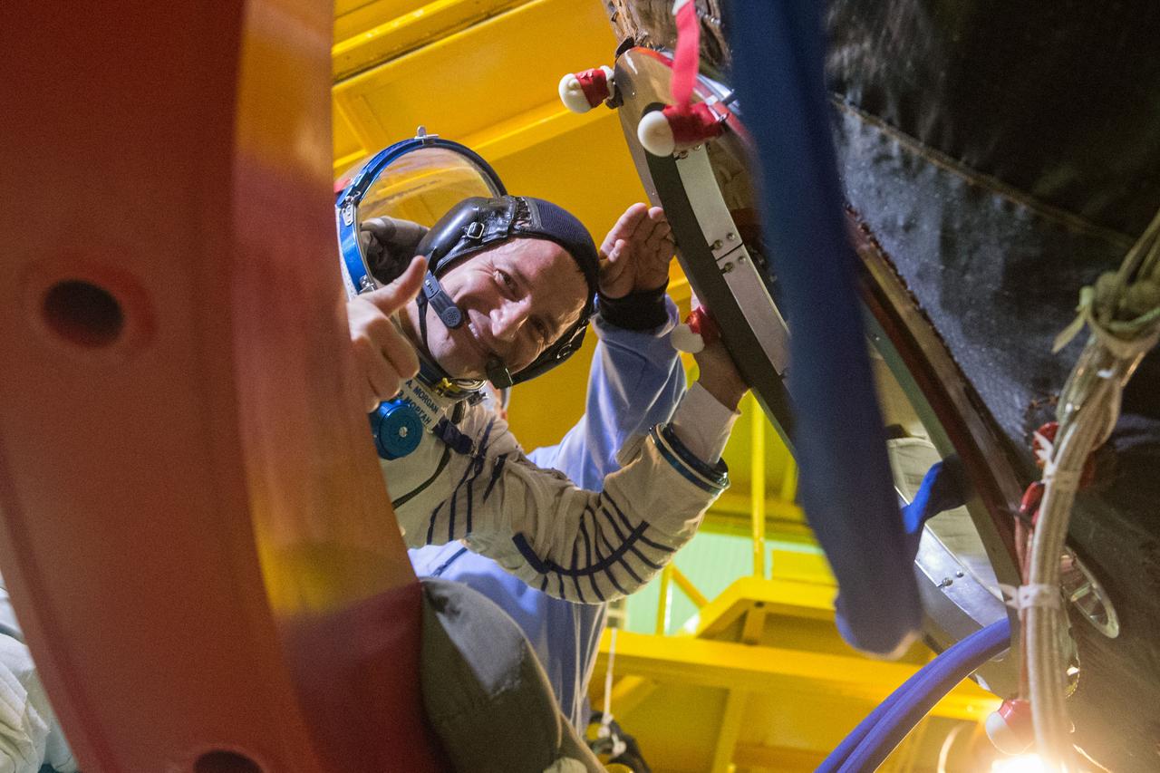 jsc2019e038386 - At the Baikonur Cosmodrome in Kazakhstan, Expedition 60 crewmember Drew Morgan of NASA waves as he boards his Soyuz spacecraft July 5 for pre-launch preparations. Morgan, Luca Parmitano of the European Space Agency and Alexander Skvortsov of Roscosmos will launch July 20 on the Soyuz MS-13 spacecraft from the Baikonur Cosmodrome for a mission on the International Space Station...Andrey Shelepin/GCTC..