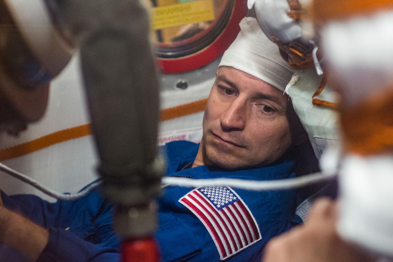 jsc2019e038387 - At the Baikonur Cosmodrome in Kazakhstan, Expedition 60 crewmember Drew Morgan of NASA runs through procedures aboard his Soyuz spacecraft July 5 as part of pre-launch preparations. Morgan, Luca Parmitano of the European Space Agency and Alexander Skvortsov of Roscosmos will launch July 20 on the Soyuz MS-13 spacecraft from the Baikonur Cosmodrome for a mission on the International Space Station...Andrey Shelepin/GCTC.