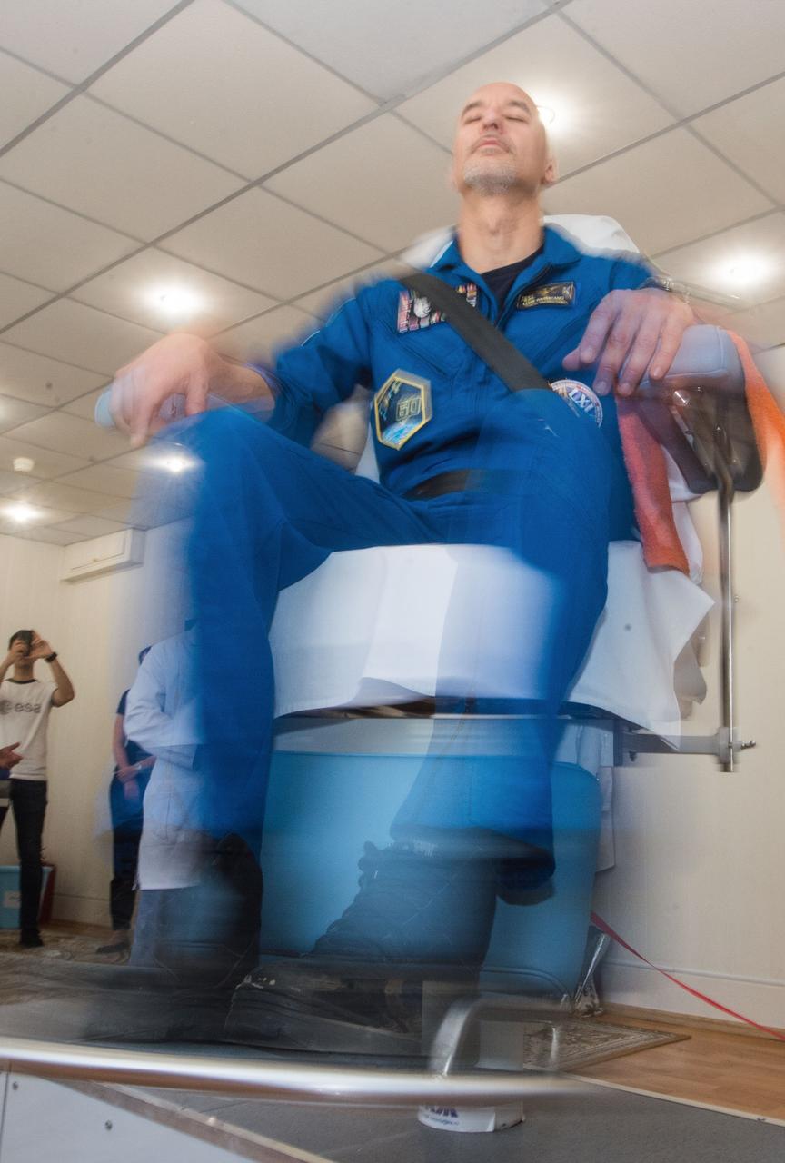 jsc2019e039267 - At the Cosmonaut Hotel crew quarters in Baikonur, Kazakhstan, Expedition 60 crewmember Luca Parmitano of the European Space Agency takes a ride in a spinning chair July 12 to test his vestibular system as part of pre-launch activities. Parmitano, Drew Morgan of NASA and Alexander Skvortsov of Roscosmos will launch July 20 on the Soyuz MS-13 spacecraft from the Baikonur Cosmodrome in Kazakhstan on a mission to the International Space Station...Andrey Shelepin/GCTC.