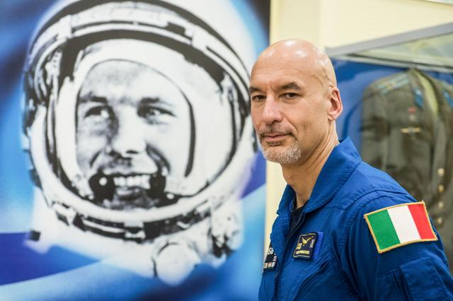jsc2019e039426 - At the Baikonur Cosmodrome in Kazakhstan, Expedition 60 crewmember Luca Parmitano of the European Space Agency poses for pictures July 16 next to a wall mural of Yuri Gagarin, the first human to fly in space. Parmitano, Drew Morgan of NASA and Alexander Skvortsov of Roscosmos will launch July 20 on the Soyuz MS-13 spacecraft from the Baikonur Cosmodrome for a mission on the International Space Station...Andrey Shelepin/GCTC.