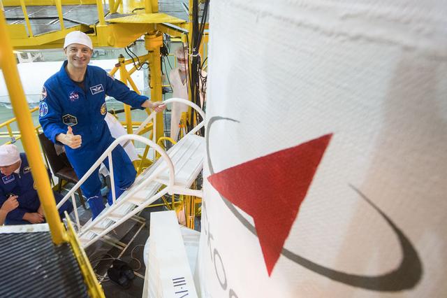 jsc2019e039434 - At the Baikonur Cosmodrome in Kazakhstan, Expedition 60 crewmember Drew Morgan of NASA flashes a thumbs up July 16 as he boards the Soyuz MS-13 spacecraft for a final fit check as part of pre-launch preparations. Morgan, Alexander Skvortsov of Roscosmos and Luca Parmitano of the European Space Agency will launch July 20 on the Soyuz MS-13 spacecraft from the Baikonur Cosmodrome for a mission on the International Space Station...Andrey Shelepin/GCTC.