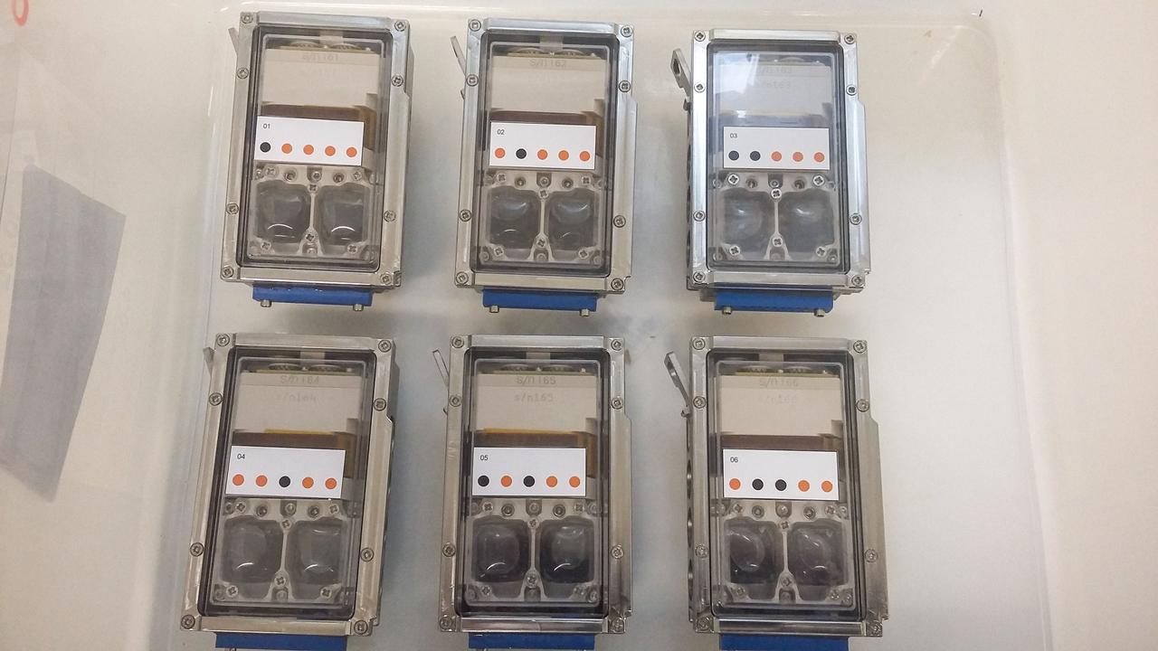 jsc2019e039818 (11/18/2018) --- Preflight imagery of six filled bioreactors from the BioRock project showing culture chambers containing growing microbes in media with basalt rocks. The purpose of the Biorock investigation is to examine the effects of altered gravity on the rock/microbe/liquid system as a whole. (Image Courtesy of: ESA)