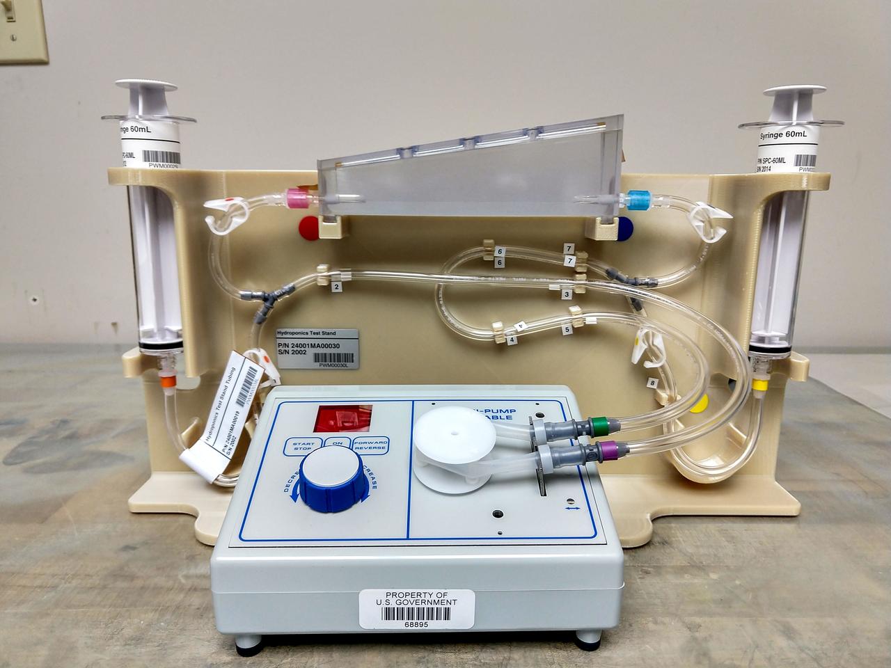 jsc2019e041775 (5/10/2019) --- Preflight imagery of a Plant Water Management (PWM) Harness and Soil Test Article.  Plant Water Management demonstrates a hydroponic method for ensuring adequate hydration and aeration to the root zone in order to sustain plants from germination through harvest. Low-gravity capillary fluidics deliver water in single and multiple plant production chambers, and researchers compare growth of individual plants in microgravity and normal gravity.