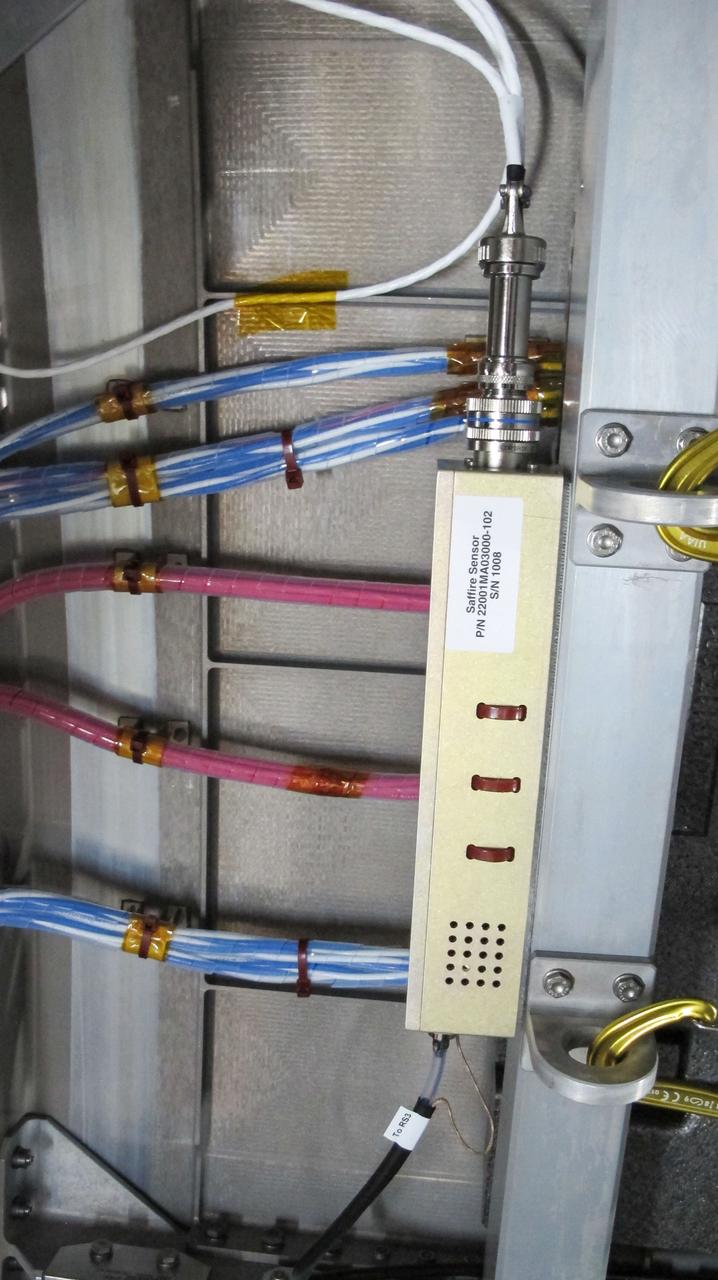 jsc2019e050038 (8/12/2019) --- Photo documentation taken during the NG-12 Crew Equipment Interface Test (CEIT) The view is of a SAFFIRE sensor. The NASA Advanced Exploration Systems program began a project to develop and demonstrate spacecraft fire safety technologies in relevant environments. The keystone of these demonstrations is a large-scale fire safety experiment conducted on an International Space Station (ISS) re-supply vehicle after it has undocked from the ISS and before it enters the atmosphere.