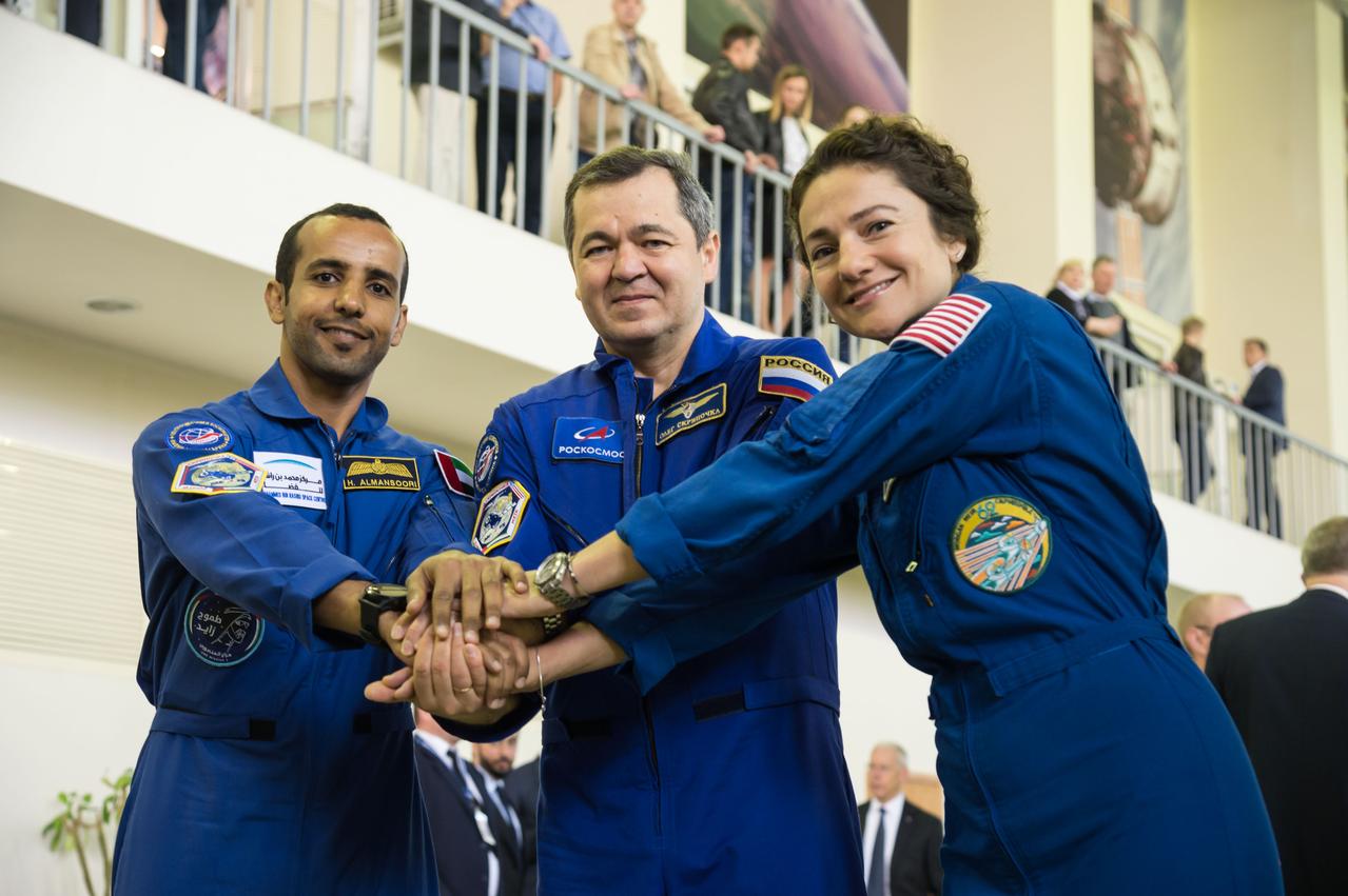jsc2019e051807 - At the Gagarin Cosmonaut Training Center in Star City, Russia, the next crew to launch to the International Space Station posed for pictures Aug. 29 during their final qualification exams for flight. From left to right are United Arab Emirates spaceflight participant Hazzaa Ali Almansoori, and Expedition 61 crewmembers Oleg Skripochka of Roscosmos and Jessica Meir of NASA. They will launch Sept. 25 from the Baikonur Cosmodrome in Kazakhstan on the Soyuz MS-15 spacecraft...NASA/Beth Weissinger.