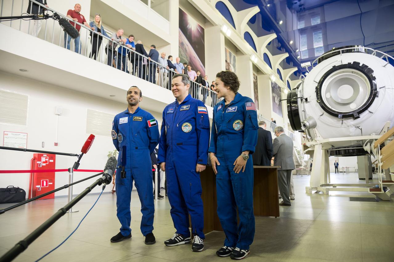 jsc2019e051809 - At the Gagarin Cosmonaut Training Center in Star City, Russia, the next crew to launch to the International Space Station responded to reporters’ questions Aug. 29 during their final qualification exams for flight. From left to right are United Arab Emirates spaceflight participant Hazzaa Ali Almansoori, and Expedition 61 crewmembers Oleg Skripochka of Roscosmos and Jessica Meir of NASA. They will launch Sept. 25 from the Baikonur Cosmodrome in Kazakhstan on the Soyuz MS-15 spacecraft...NASA/Beth Weissinger.