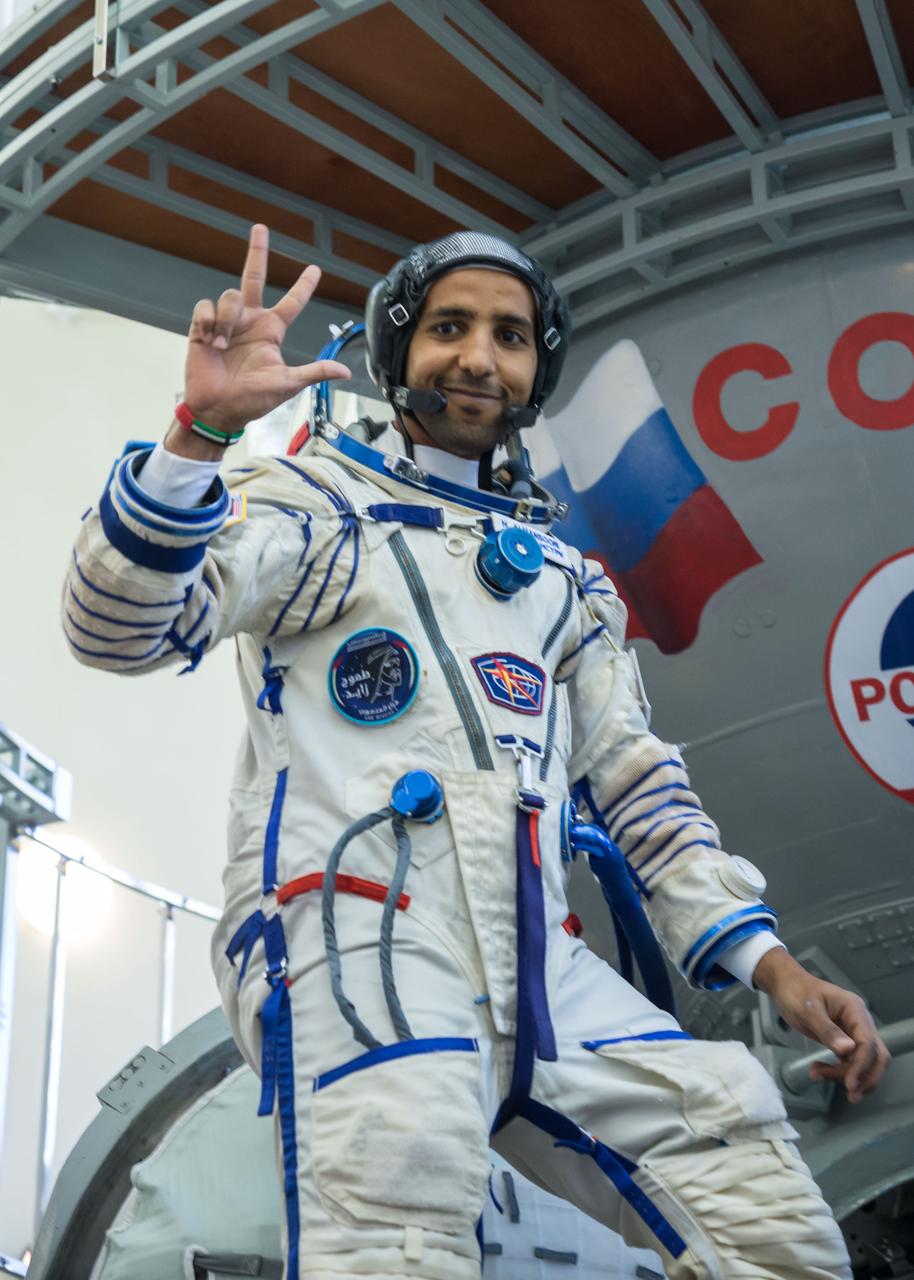 jsc2019e051847 - At the Gagarin Cosmonaut Training Center in Star City, Russia, spaceflight participant Hazzaa Ali Almansoori of the United Arab Emirates climbs aboard a Soyuz trainer during final crew qualification exams Aug. 30. Almansoori will launch with Expedition 61 crewmembers Oleg Skripochka of Roscosmos and Jessica Meir of NASA Sept. 25 on the Soyuz MS-15 spacecraft from the Baikonur Cosmodrome in Kazakhstan for a mission on the International Space Station...NASA/Beth Weissinger.