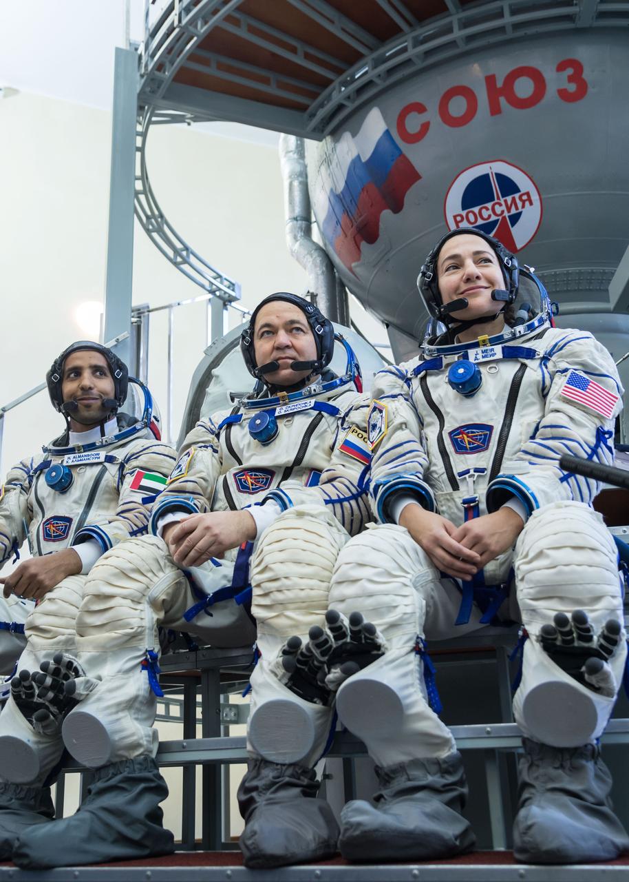 jsc2019e051851 - At the Gagarin Cosmonaut Training Center in Star City, Russia, spaceflight participant Hazzaa Ali Almansoori of the United Arab Emirates (left), Oleg Skripochka of Roscosmos (center) and Jessica Meir of NASA (right) listen to reporters’ questions Aug. 30 during crew qualification exams. They will launch Sept. 25 on the Soyuz MS-15 spacecraft from the Baikonur Cosmodrome in Kazakhstan for a mission on the International Space Station...NASA/Beth Weissinger.