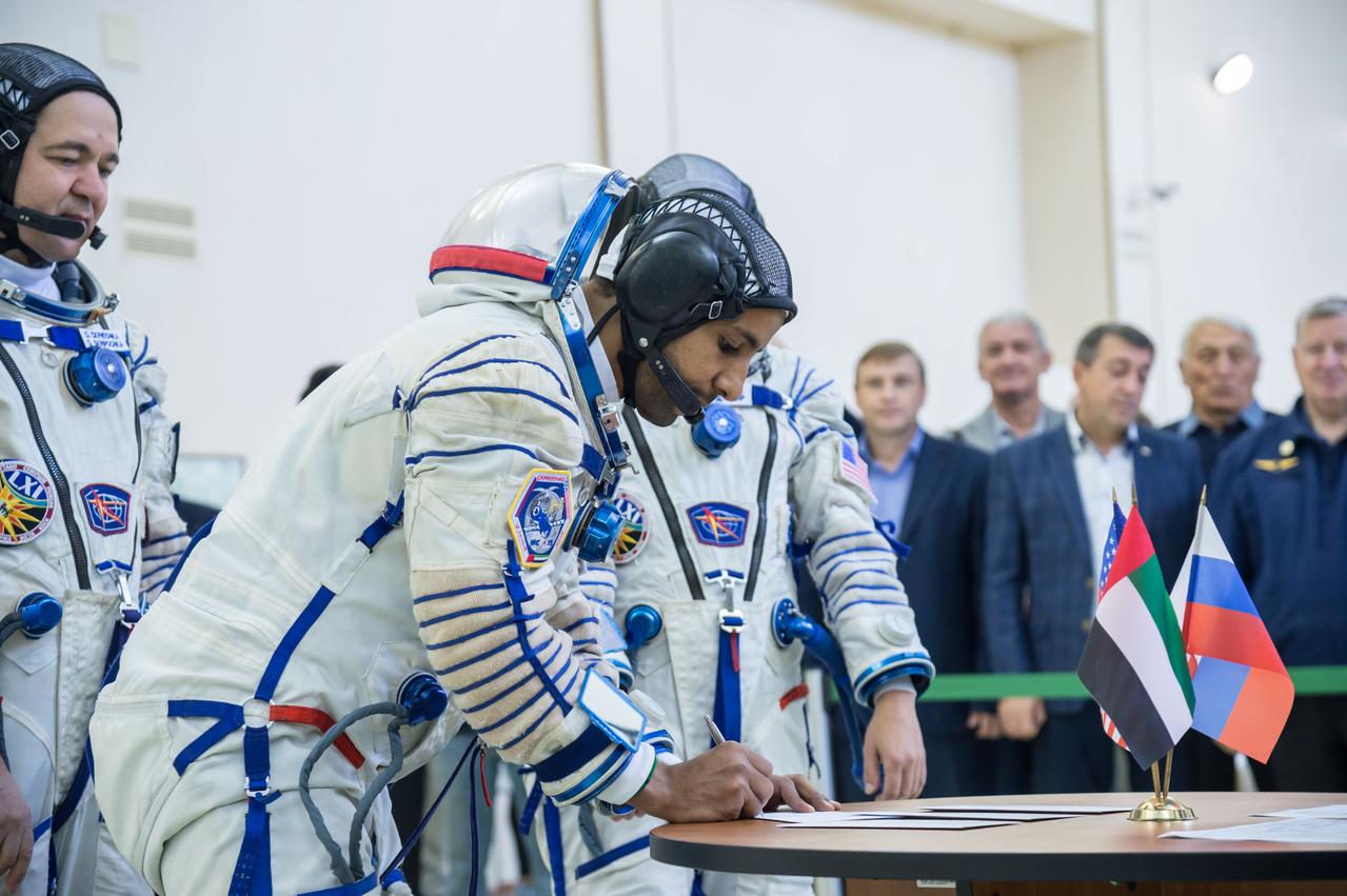 jsc2019e051857 - At the Gagarin Cosmonaut Training Center in Star City, Russia, spaceflight participant Hazzaa Ali Almansoori of the United Arab Emirates signs in for the second day of crew qualification exams Aug. 30. Along with Expedition 61 crewmembers Oleg Skripochka of Roscosmos and Jessica Meir of NASA, Almansoori will launch Sept. 25 on the Soyuz MS-15 spacecraft from the Baikonur Cosmodrome in Kazakhstan for a mission on the International Space Station...NASA/Beth Weissinger.