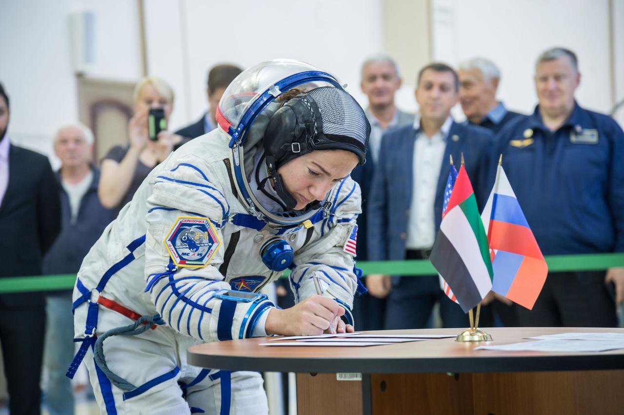jsc2019e051858 - At the Gagarin Cosmonaut Training Center in Star City, Russia, Expedition 61 crewmember Jessica Meir of NASA signs in for the second day of crew qualification exams Aug. 30. Along with Expedition 61 crewmember Oleg Skripochka of Roscosmos and spaceflight participant Hazzaa Ali Almansoori of the United Arab Emirates, Meir will launch Sept. 25 on the Soyuz MS-15 spacecraft from the Baikonur Cosmodrome in Kazakhstan for a mission on the International Space Station...NASA/Beth Weissinger.