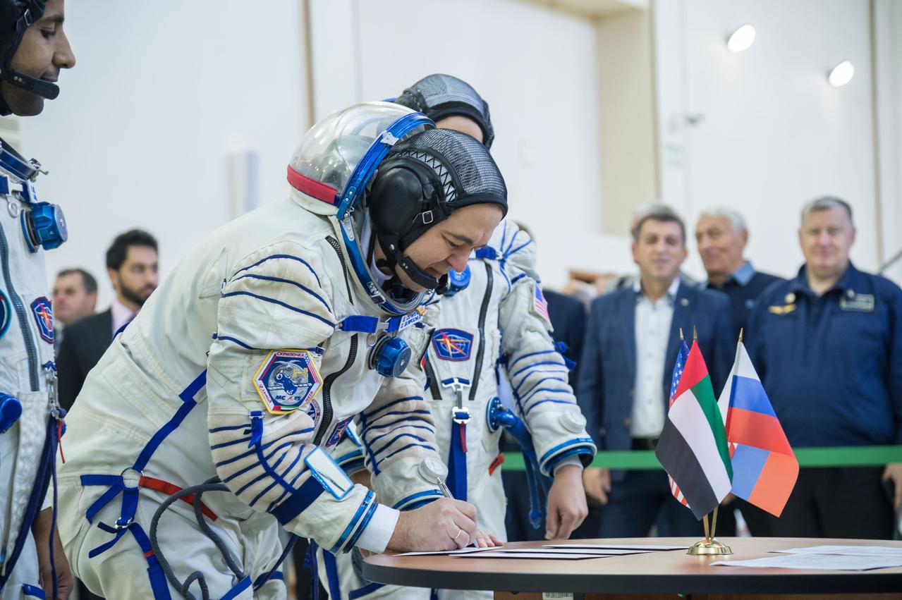 jsc2019e051859 - At the Gagarin Cosmonaut Training Center in Star City, Russia, Expedition 61 crewmember Oleg Skripochka of Roscosmos signs in for the second day of crew qualification exams Aug. 30. Along with Expedition 61 crewmember Jessica Meir of NASA and spaceflight participant Hazzaa Ali Almansoori of the United Arab Emirates, Skripochka will launch Sept. 25 on the Soyuz MS-15 spacecraft from the Baikonur Cosmodrome in Kazakhstan for a mission on the International Space Station...NASA/Beth Weissinger..