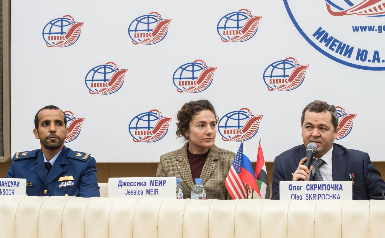 jsc2019e052149 - At the Gagarin Cosmonaut Training Center in Star City, Russia, Expedition 61 crewmember Oleg Skripochka of Roscosmos (right) answers a reporter’s question Sept. 5 during a pre-flight news conference. Looking on are Expedition 61 crewmate Jessica Meir of NASA (center) and spaceflight participant Hazzaa Ali Almansoori of the United Arab Emirates. They will launch Sept. 25 from the Baikonur Cosmodrome in Kazakhstan on the Soyuz MS-15 spacecraft for a mission on the International Space Station...Credit/Gagarin Cosmonaut Training Center..