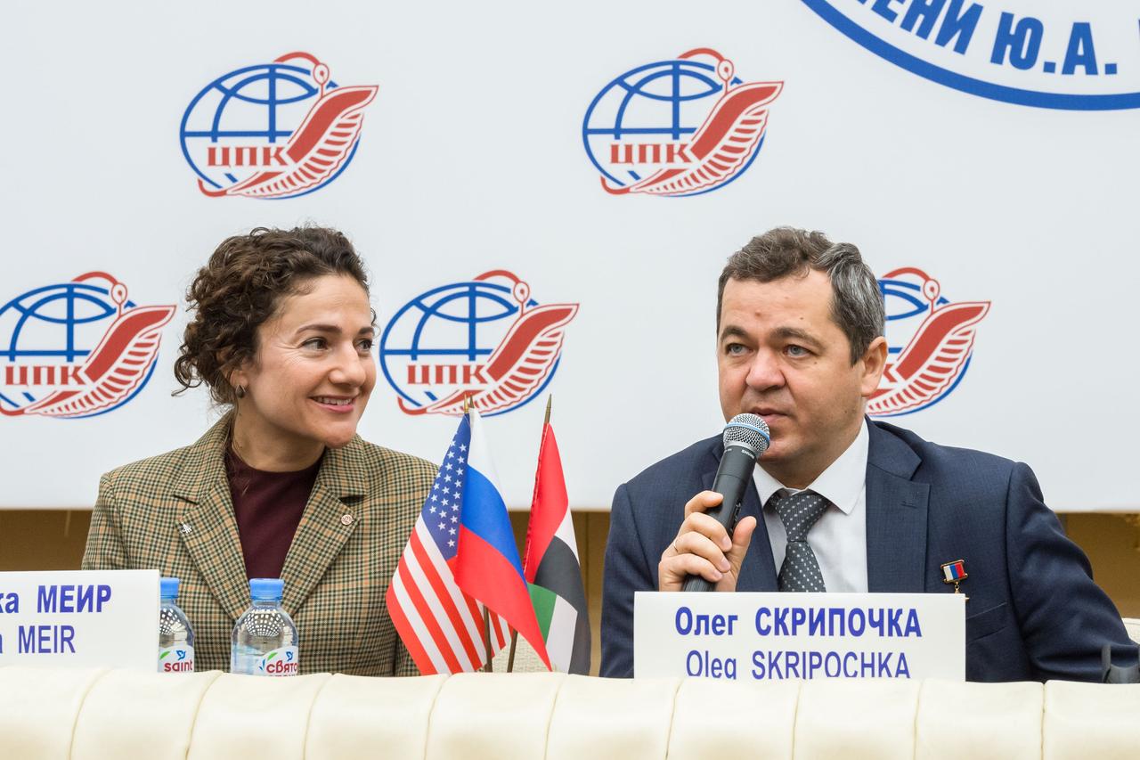 jsc2019e052150 - At the Gagarin Cosmonaut Training Center in Star City, Russia, Expedition 61 crewmember Oleg Skripochka of Roscosmos (right) answers a reporter’s question Sept. 5 during a pre-flight news conference. Looking on is Expedition 61 crewmate Jessica Meir of NASA. Skripochka, Meir and spaceflight participant Hazzaa Ali Almansoori of the United Arab Emirates will launch Sept. 25 from the Baikonur Cosmodrome in Kazakhstan on the Soyuz MS-15 spacecraft for a mission on the International Space Station...Credit/Gagarin Cosmonaut Training Center.