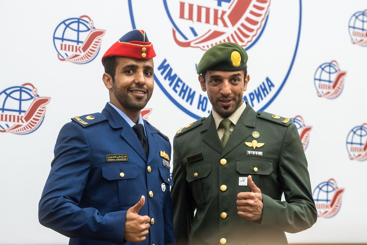 jsc2019e052152 - At the Gagarin Cosmonaut Training Center in Star City, Russia, prime spaceflight participant Hazzaa Ali Almansoori of the United Arab Emirates (left) and his backup, Sultan Al-Neyadi of the United Arab Emirates (right) pose for pictures Sept. 5 during a pre-flight news conference. Almansoori will launch with Expedition 61 crewmembers Oleg Skripochka of Roscosmos and Jessica Meir of NASA Sept. 25 from the Baikonur Cosmodrome in Kazakhstan on the Soyuz MS-15 spacecraft for a mission on the International Space Station...Credit/Gagarin Cosmonaut Training Center.