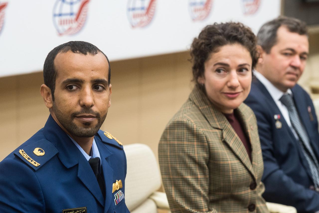 jsc2019e052153 - At the Gagarin Cosmonaut Training Center in Star City, Russia, spaceflight participant Hazzaa Ali Almansoori of the United Arab Emirates (left), Jessica Meir of NASA (center) and Oleg Skripochka of Roscosmos listen to a reporter’s question Sept. 5 as part of a pre-flight news conference. They will launch Sept. 25 from the Baikonur Cosmodrome in Kazakhstan on the Soyuz MS-15 spacecraft for a mission on the International Space Station...Credit/Gagarin Cosmonaut Training Center.