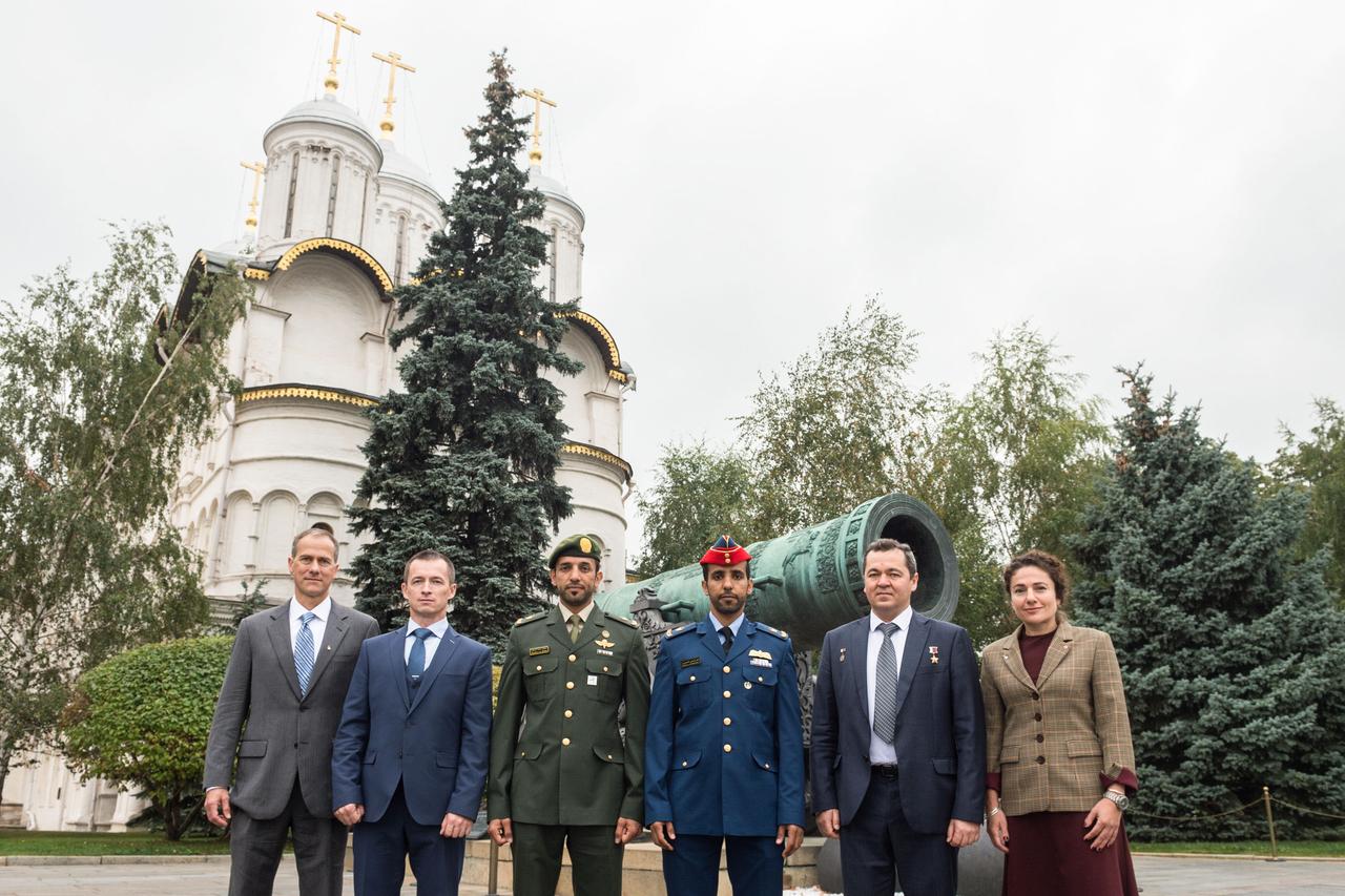 jsc2019e052235 - Inside the grounds of the Kremlin in Moscow, the prime and backup crewmembers for the next launch to the International Space Station pose for pictures in front of the Tsar Cannon Sept. 5 as part of pre-flight activities. From left to right are the backup crewmembers, Tom Marshburn of NASA, Sergey Ryzhikov of Roscosmos and spaceflight participant Sultan Al-Neyadi of the United Arab Emirates and the prime crewmembers, spaceflight participant Hazzaa Ali Almansoori of the United Arab Emirates, Oleg Skripochka of Roscosmos and Jessica Meir of NASA. Meir, Skripochka and Almansoori will launch Sept. 25 from the Baikonur Cosmodrome in Kazakhstan on the Soyuz MS-15 spacecraft for a mission on the International Space Station...Andrey Shelepin/Gagarin Cosmonaut Training Center.