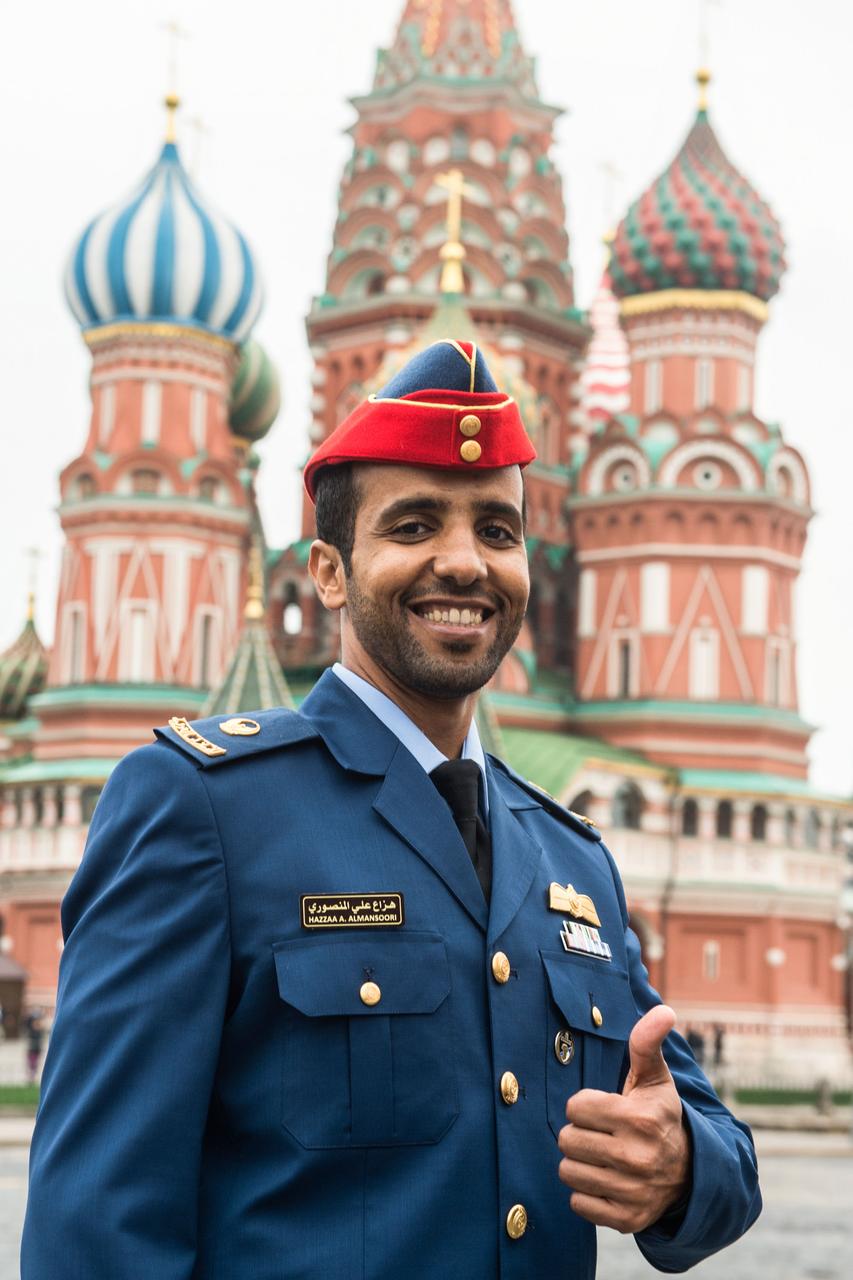 jsc2019e052242 - With St. Basil’s Cathedral at Red Square in Moscow serving as a backdrop, spaceflight participant Hazzaa Ali Almansoori of the United Arab Emirates flashes a thumbs up sign Sept. 5 during traditional pre-flight activities. Almansoori and Expedition 61 crewmembers Oleg Skripochka of Roscosmos and Jessica Meir of NASA will launch Sept. 25 from the Baikonur Cosmodrome in Kazakhstan on the Soyuz MS-15 spacecraft for a mission on the International Space Station...Andrey Shelepin/Gagarin Cosmonaut Training Center.