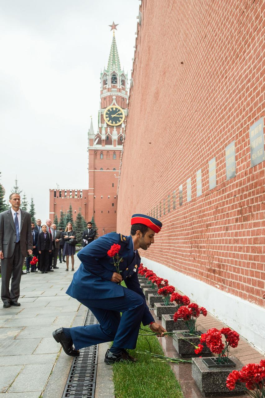 jsc2019e052248 - At the Kremlin Wall in Red Square in Moscow, spaceflight participant Hazzaa Ali Almansoori of the United Arab Emirates lays flowers where Russian space icons are interred Sept. 5 as part of traditional pre-flight ceremonies. Almansoori, and Expedition 61 crewmembers Jessica Meir of NASA and Oleg Skripochka of Roscosmos will launch Sept. 25 from the Baikonur Cosmodrome in Kazakhstan on the Soyuz MS-15 spacecraft for a mission on the International Space Station...Andrey Shelepin/Gagarin Cosmonaut Training Center.