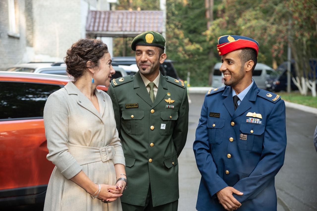 jsc2019e052745 - At the Gagarin Cosmonaut Training Center in Star City, Russia, Expedition 61 crewmember Jessica Meir of NASA (left) chats with backup spaceflight participant Sultan Al-Neyadi of the United Arab Emirates (center) ad prime spaceflight participant Hazzaa Ali Almansoori of the United Arab Emirates (right) Sept. 10 before departing for their launch site at the Baikonur Cosmodrome in Kazakhstan. Meir, Oleg Skripochka of Roscosmos and Almansoori will launch on Sept. 25 from the Baikonur Cosmodrome on the Soyuz MS-15 spacecraft for a mission on the International Space Station...NASA/Beth Weissinger