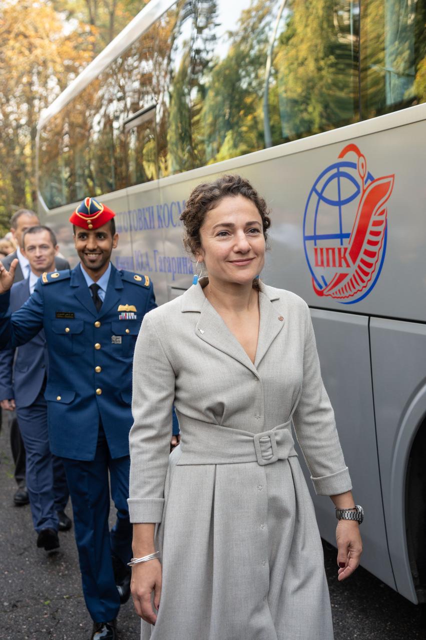 jsc2019e052749 - At the Gagarin Cosmonaut Training Center in Star City, Russia, Expedition 61 crewmember Jessica Meir of NASA (right) and spaceflight participant Hazzaa Ali Almansoori of the United Arab Emirates (left) walk to a bus Sept. 10 that will take them to a nearby airfield for a flight to their launch site at the Baikonur Cosmodrome in Kazakhstan. Meir, Almansoori and Oleg Skripochka of Roscosmos will launch on Sept. 25 from the Baikonur Cosmodrome on the Soyuz MS-15 spacecraft for a mission on the International Space Station...NASA/Beth Weissinger
