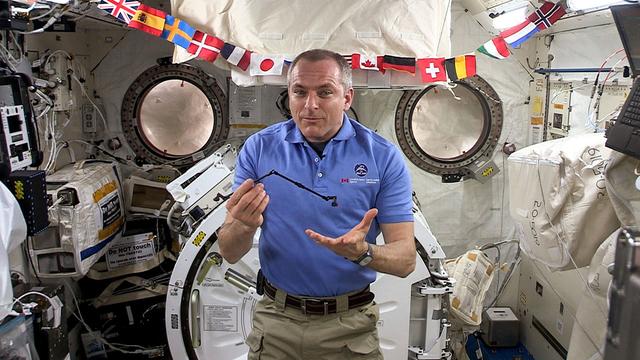 jsc2019e052832 (5/15/2019) — Canadian Space Agency (CSA) astronaut David Saint-Jacques speaks to students about space robotics, using a 1:50 scale model of Canadarm2 aboard the International Space Station (ISS). Image courtesy of: CSA