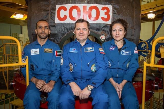 NASA image: jsc2019e052880 - In the Integration Building at the Baikonur Cosmodrome in Kazakhstan, spaceflight participant Hazzaa Ali Almansoori of the United Arab Emirates (left) and Expedition 61 crewmates Oleg Skripochka of Roscosmos (center) and Jessica Meir of N