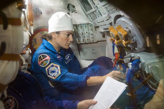 NASA image: jsc2019e052882 - In the Integration Building at the Baikonur Cosmodrome in Kazakhstan, Expedition 61 crewmember Jessica Meir of NASA runs through procedures Sept. 11 aboard the Soyuz MS-15 spacecraft during an initial Soyuz vehicle fit check. Meir, spacef