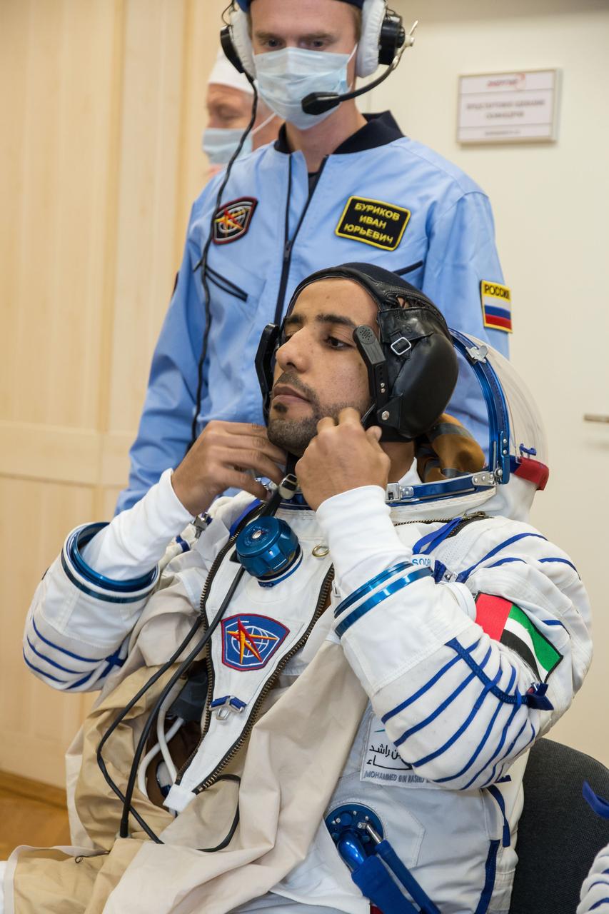 In the Integration Building at the Baikonur Cosmodrome in Kazakhstan, spaceflight participant Hazzaa Ali Almansoori of the United Arab Emirates suits up Sept. 11 for a fit check aboard the Soyuz MS-15 spacecraft. Almansoori, Oleg Skripochka of Roscosmos and Jessica Meir of NASA will launch Sept. 25 on the Soyuz MS-15 spacecraft from the Baikonur Cosmodrome for a mission on the International Space Station. NASA/Victor Zelentsov
