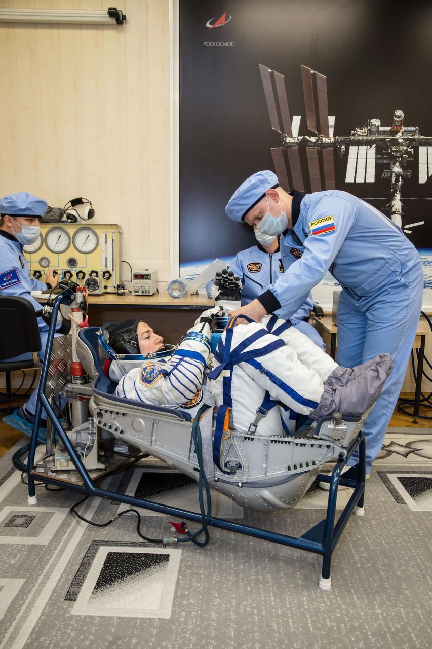 jsc2019e052886 - In the Integration Building at the Baikonur Cosmodrome in Kazakhstan, Expedition 61 crewmember Jessica Meir of NASA undergoes a pressure and leak check of her Russian Sokol launch and entry suit Sept. 11 for a fit check aboard the Soyuz MS-15 spacecraft. Meir, Hazzaa Ali Almansoori of the United Arab Emirates and Expedition 61 crewmember Oleg Skripochka of Roscosmos will launch Sept. 25 on the Soyuz MS-15 spacecraft from the Baikonur Cosmodrome for a mission on the International Space Station...NASA/Victor Zelentsov.